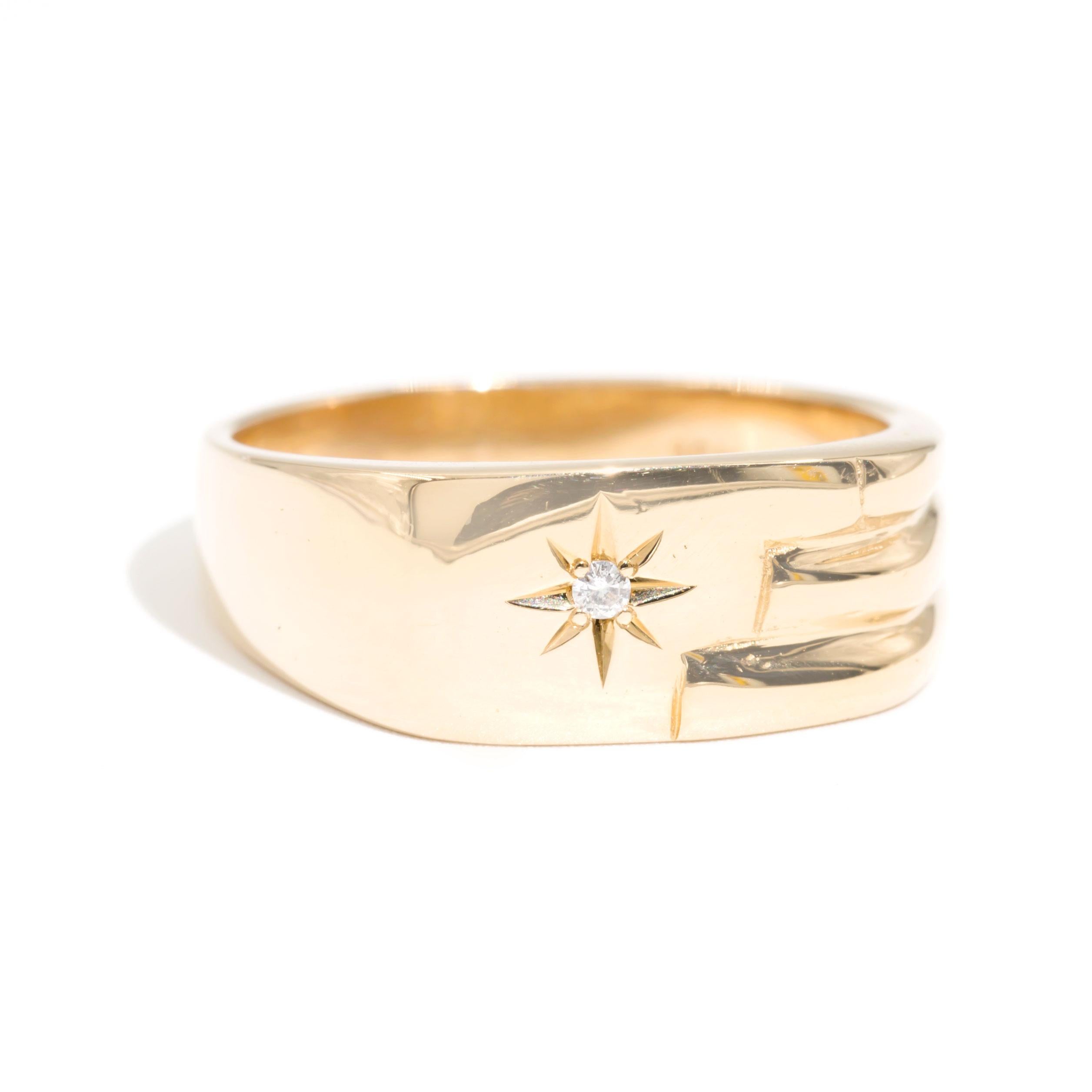 Forged in 18 carat yellow gold is this handsome mens signet ring featuring a star set round brilliant diamond and smooth curved lines flowing down one side.  We have named this dapper vintage ring The Devon Signet Ring.  The Devon Signet Ring is