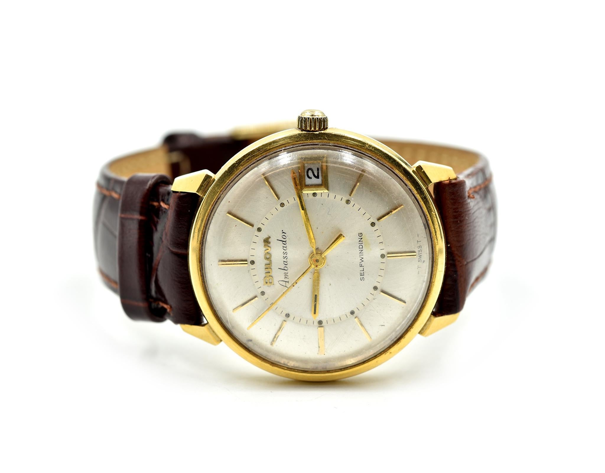 Movement: automatic, shock proof, anti-magnetic
Function: hours, minutes, sweep seconds, date
Case: 33mm 18k yellow gold case, acrylic (plastic) crystal
Band: generic brown leather strap, gold plated buckle
Dial: silver dial, gold hands, gold hour