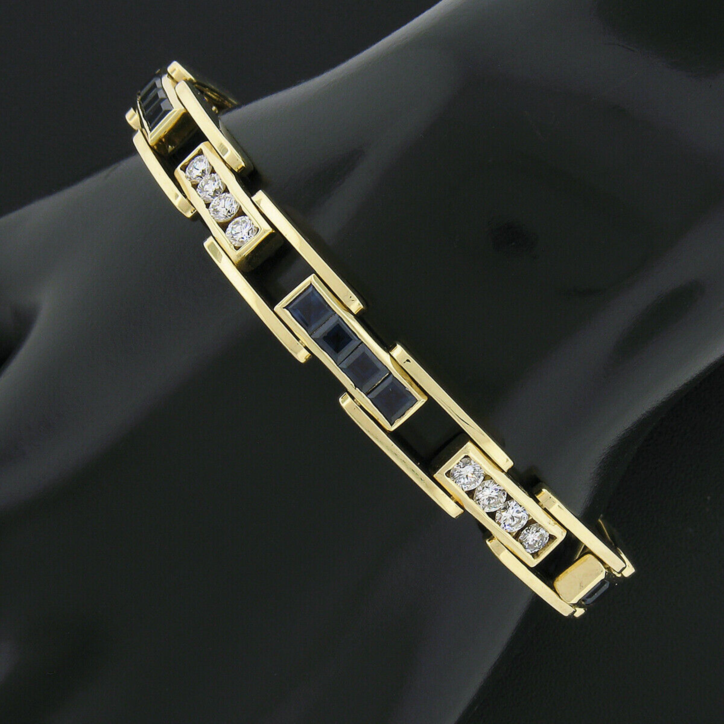 You are looking at an absolutely magnificent men's bracelet that was crafted from solid 18k yellow gold and features alternating links that are channel set with very fine quality sapphires and diamonds throughout. Two of the sapphires were randomly