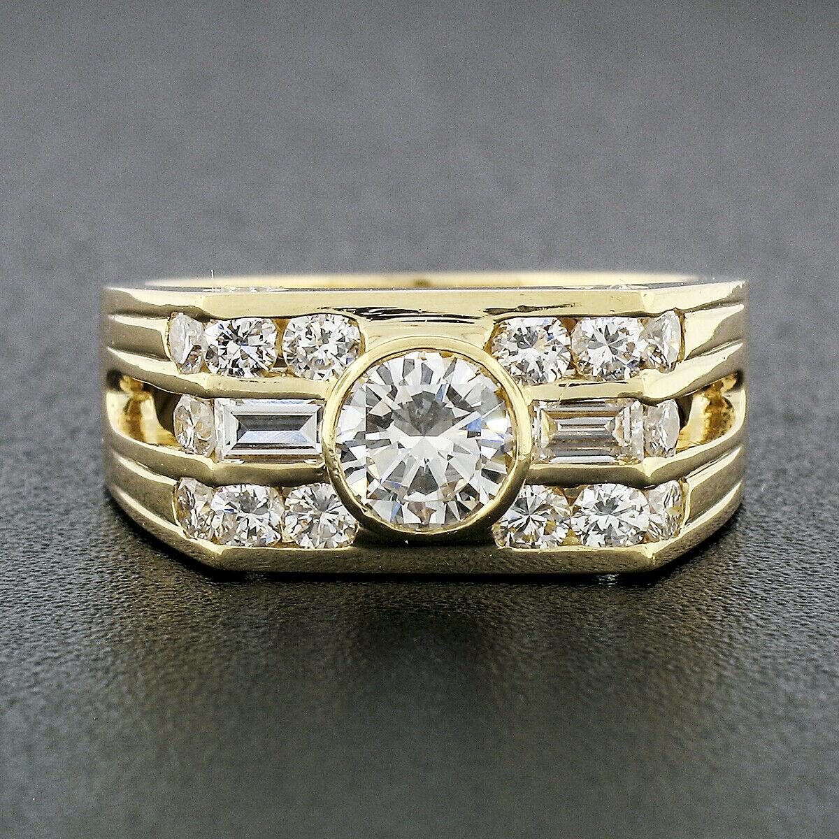 Here we have an absolutely outstanding men's band ring that was crafted from solid 18k yellow gold. It features a round brilliant cut diamond solitaire bezel set at its center with an approximate weight of 0.66 carats. That center stone is accented