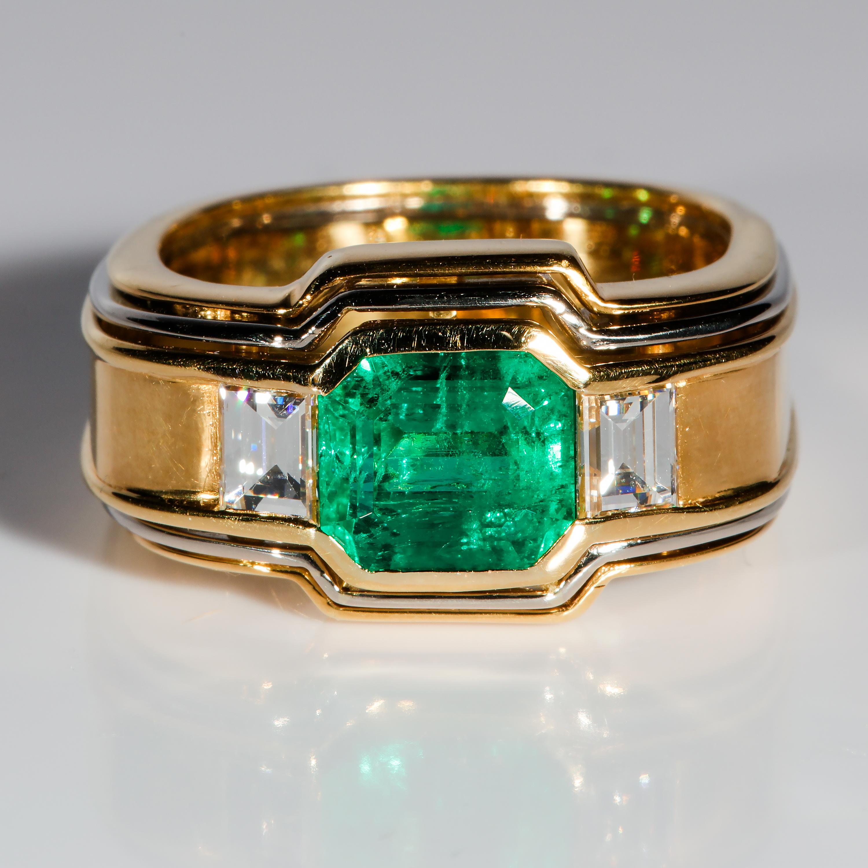A rare and impressive men's ring featuring a prize Colombian emerald of exceptional size and coloring.

This had to have been designed by an architect. The perfection in its design is startling. First and foremost, this ring is constructed around an