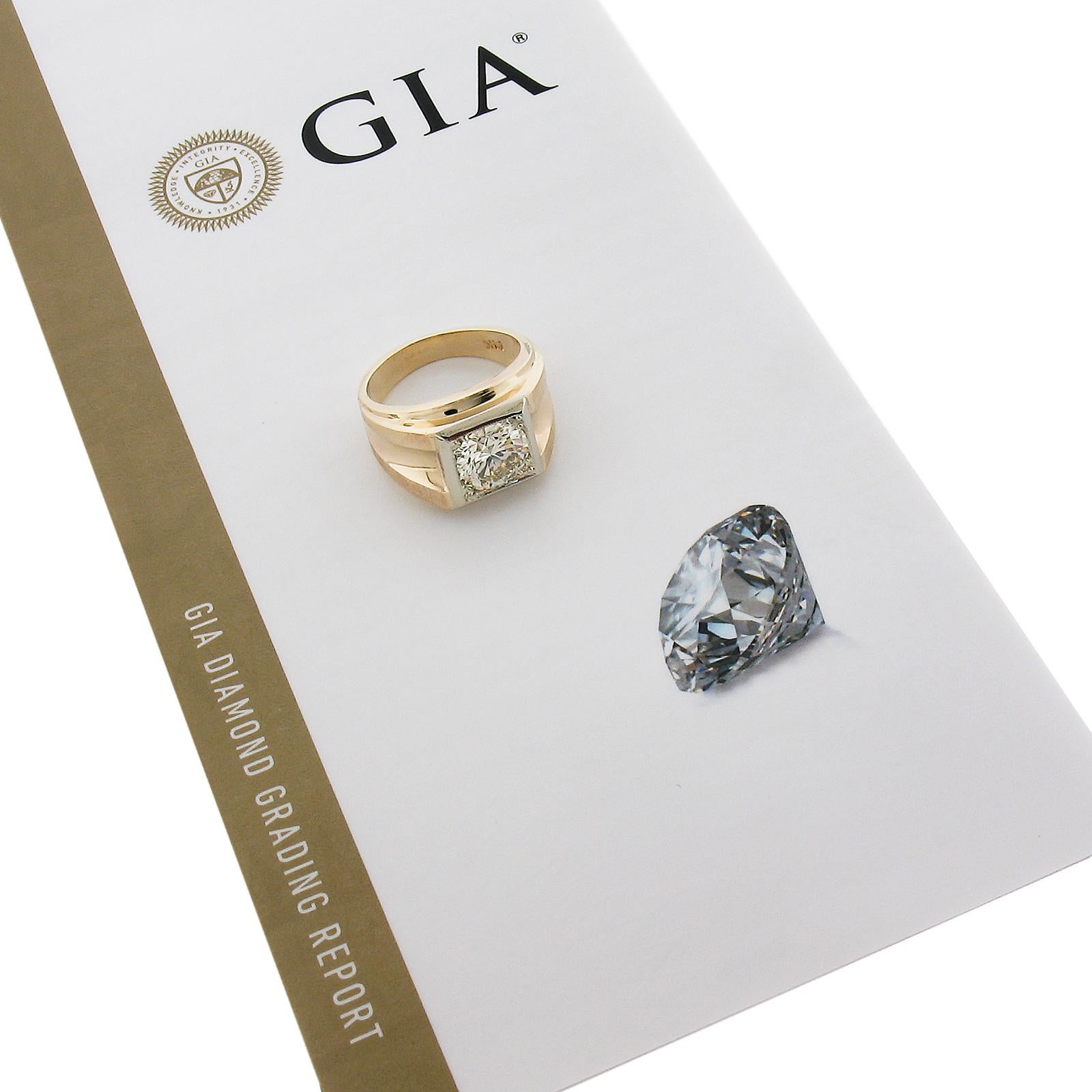 This bold and substantial men's diamond ring is crafted in yellow gold with white gold square setting and features a 3.15 carat round brilliant cut diamond that's been graded by GIA for having excellent cut and polish as well as very good symmetry