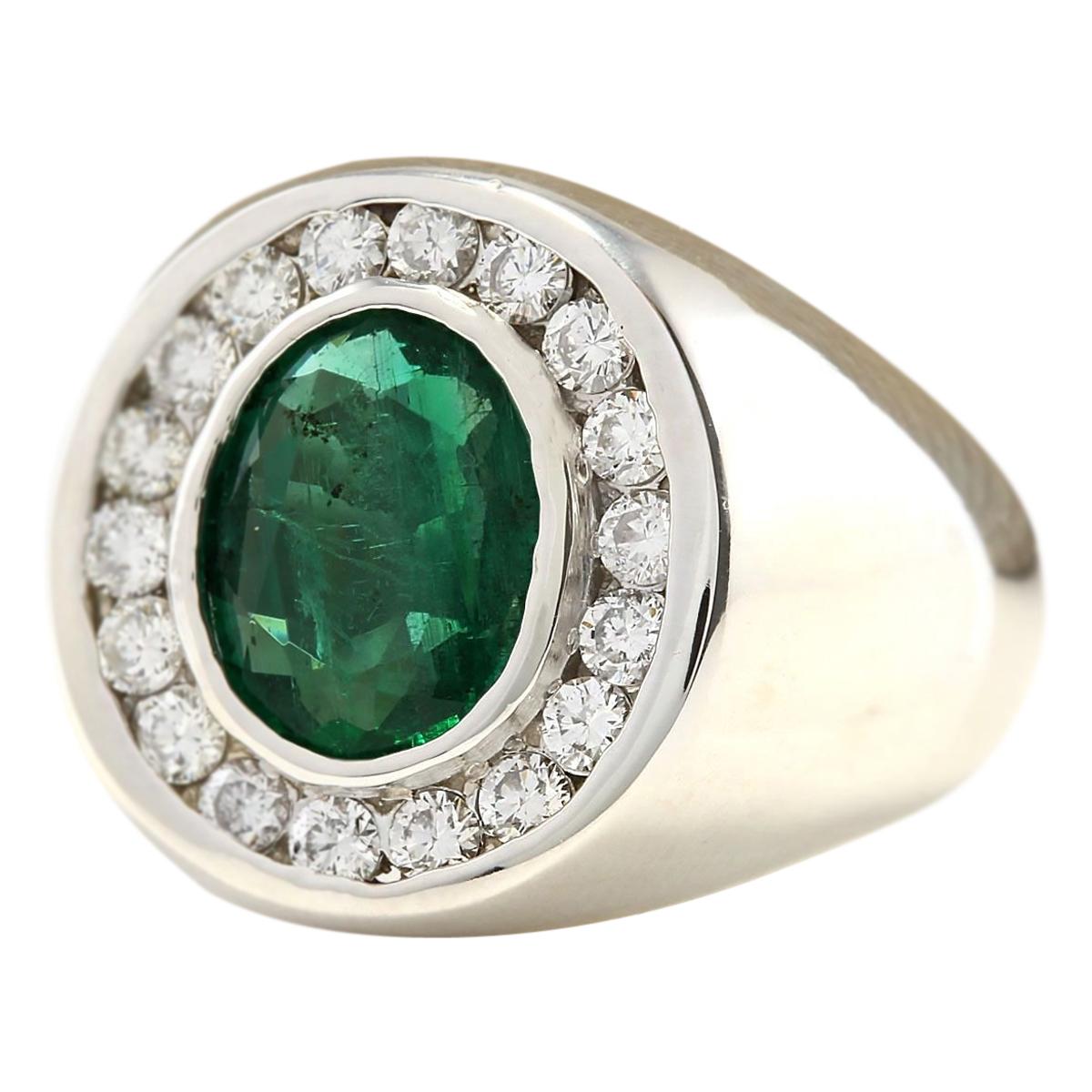 Introducing our distinguished Men's 14 Karat White Gold Diamond Ring, boasting a commanding 3.82 Carat Natural Emerald centerpiece, stamped for authenticity. Crafted with precision and elegance, this ring weighs 10.4 grams in total, symbolizing