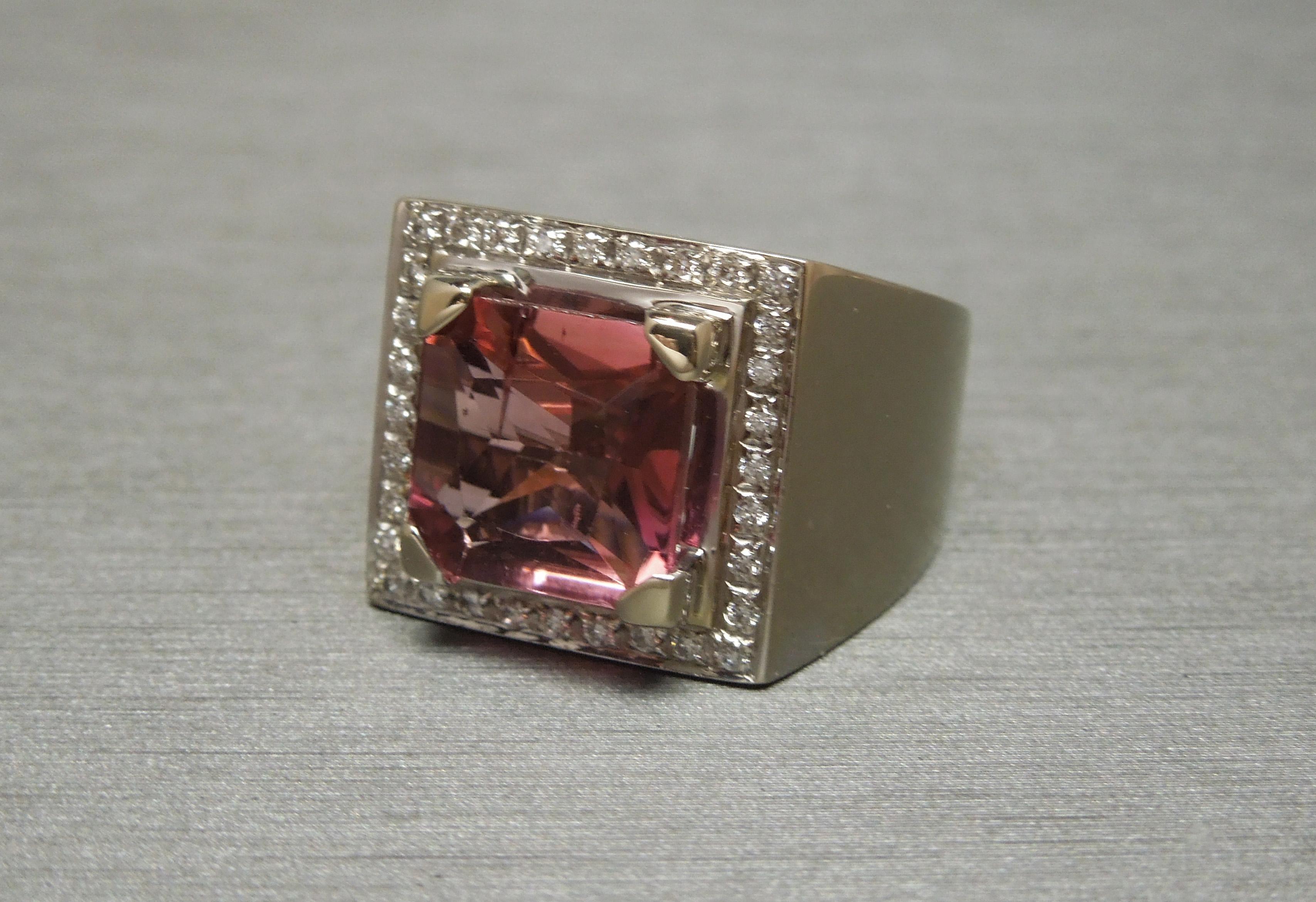 In 18KT White Gold, this European Men's Tourmaline & Diamond ring features a central Square cut 4 carat Natural Salmon colored Tourmaline at 10mm x 10mm, securely set in 4 Triangle-Shaped prongs. Slightly internally included with 2 minute inclusions