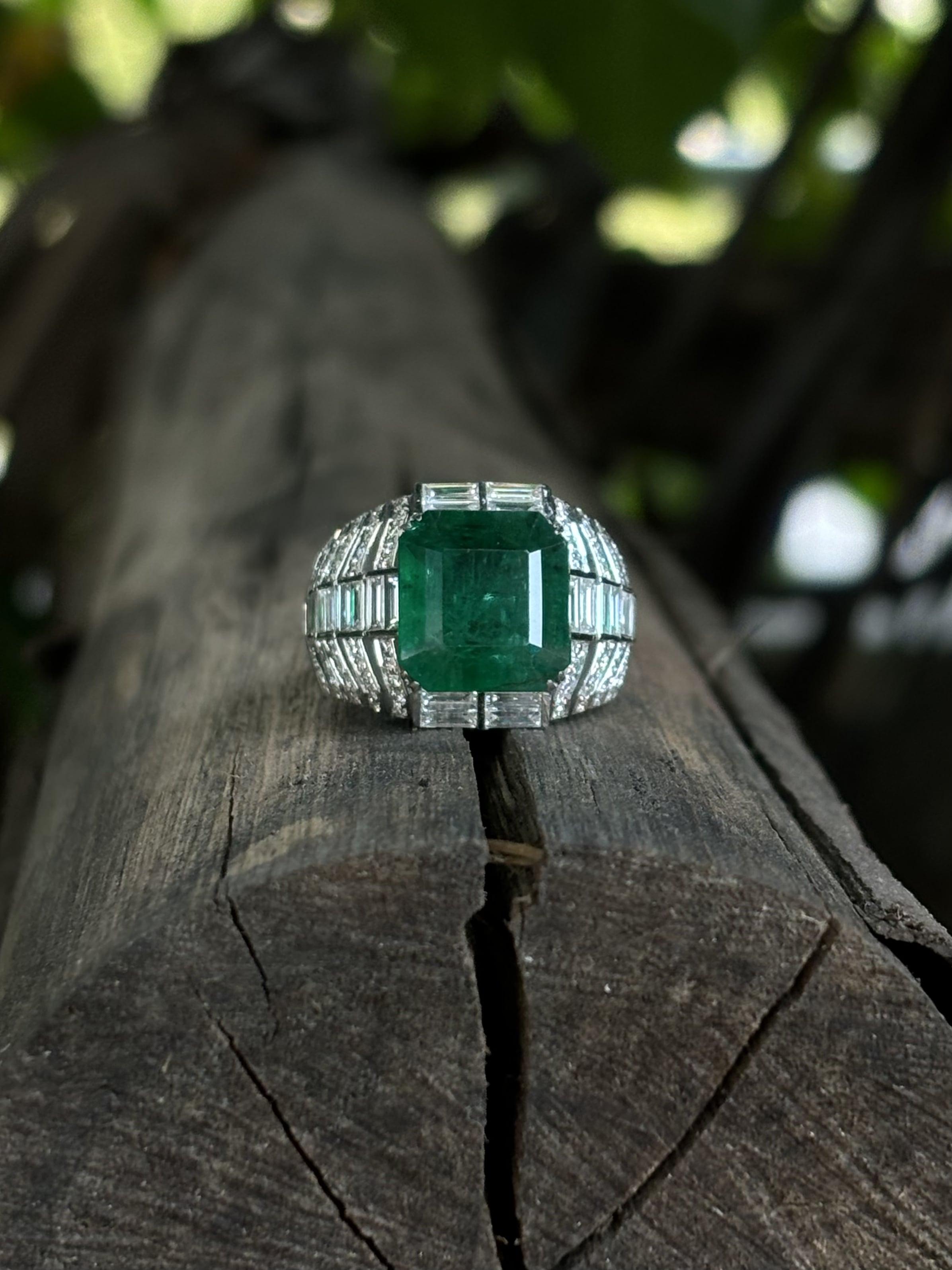 Showcasing this truly breathtaking men's ring that exudes sophistication and charm. This exquisite piece showcases a mesmerizing emerald-cut Emerald as its centerpiece, radiating with unparalleled brilliance and captivating color. With an impressive