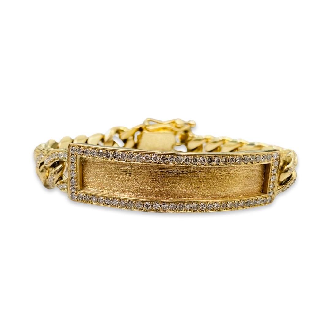 Men’s 9.00 Total Carat Weight Diamonds Cuban Link ID Bracelet. The bracelet features round natural diamonds clarity/color: G-H/VS-SI1
The bracelet weights 78.2g and is made of 14k solid gold. The bracelet is 8 inches in length and features a secure