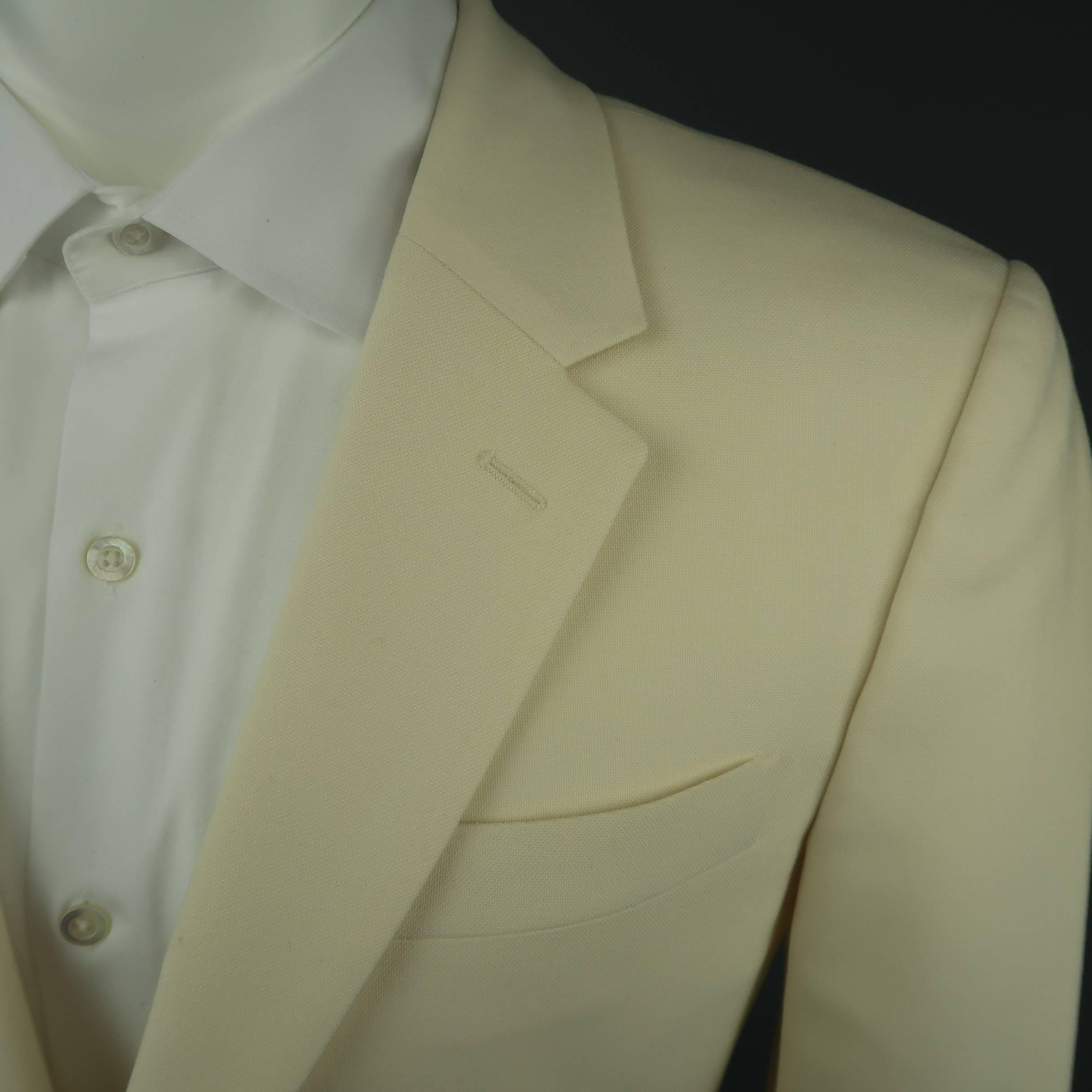 Single breasted ALEXANDER MCQUEEN sport coat comes in a creamy beige wool canvas with a notch lapel and double vented back. Sports throughout and small imperfection on back shoulder. As-is. Made in Italy.
 
Fair Pre-Owned Condition.
Marked: IT 48
