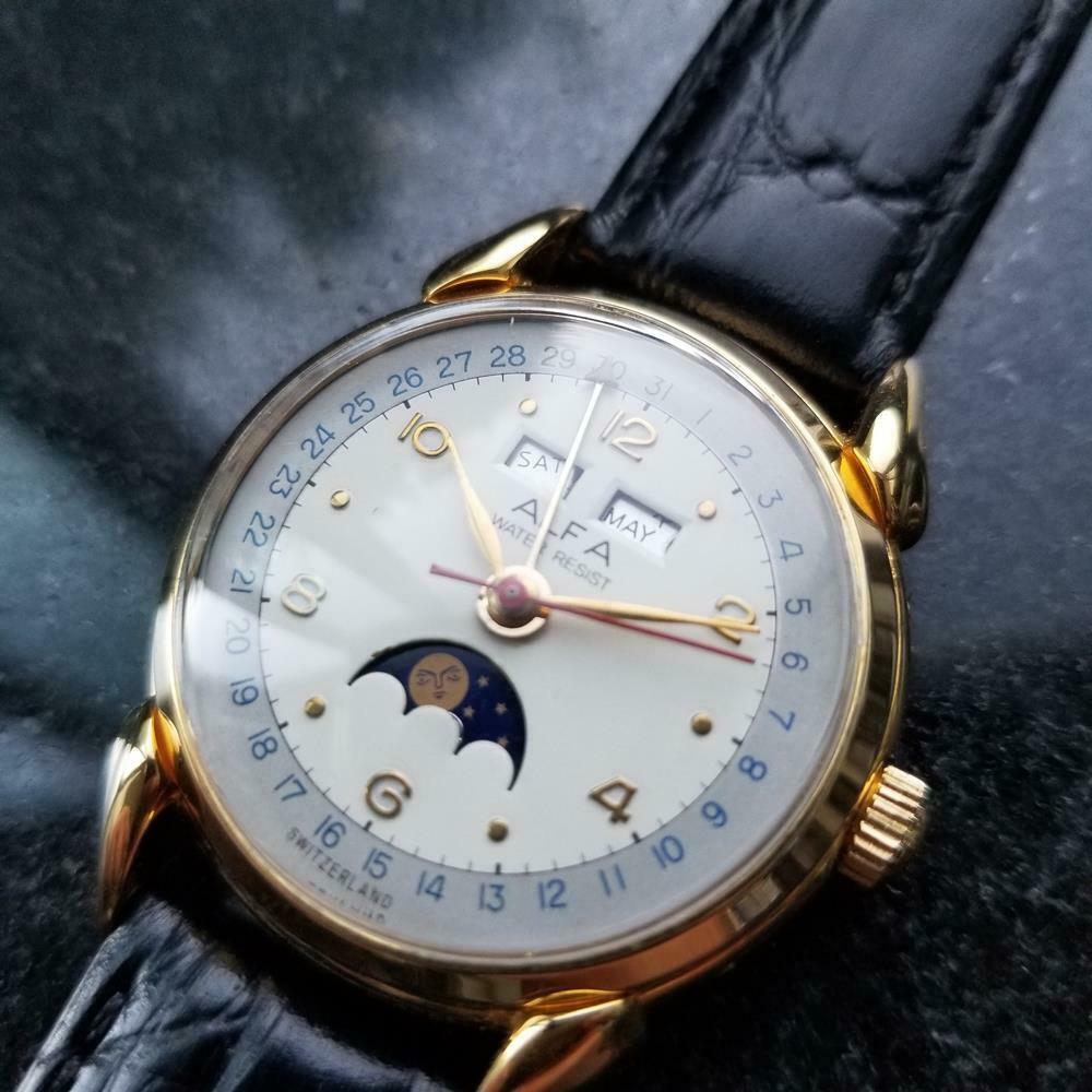 Vintage treasure, men's gold-plated Swiss Alfa triple date calendar moonphase hand-wind, c.1950s. Verified authentic by a master watchmaker. Gorgeous, two tone Alfa signed dial, applied droplet and Arabic numeral hour markers, gold minute and hour