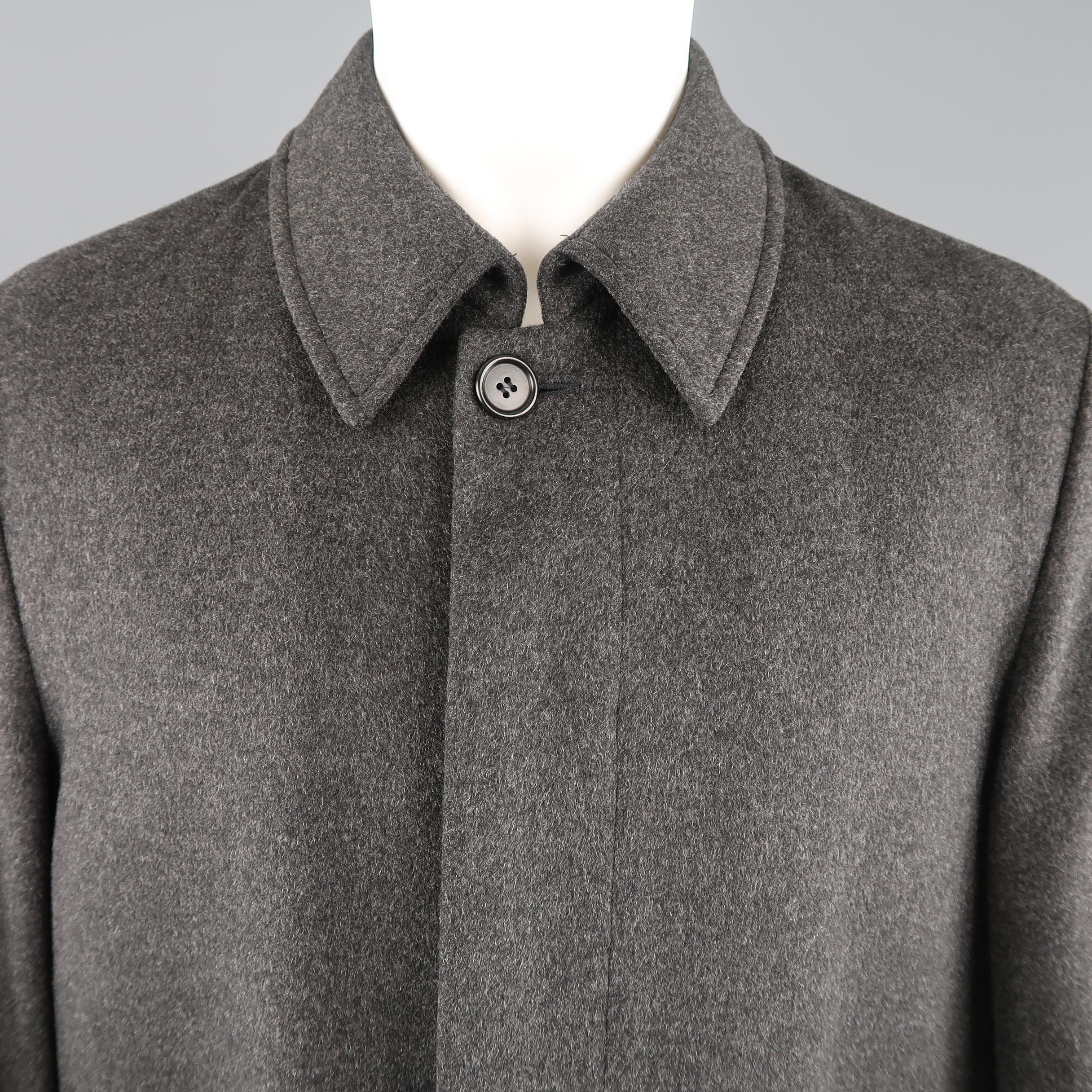 ALLEGRI car coat comes in dark heather gray wool cashmere blend fabric with a pointed collar, hidden placket button up front, slit pockets, and quilted liner. Made in Italy.
 
Excellent Pre-Owned Condition.
Marked: IT 48
 
Measurements:
 
Shoulder: