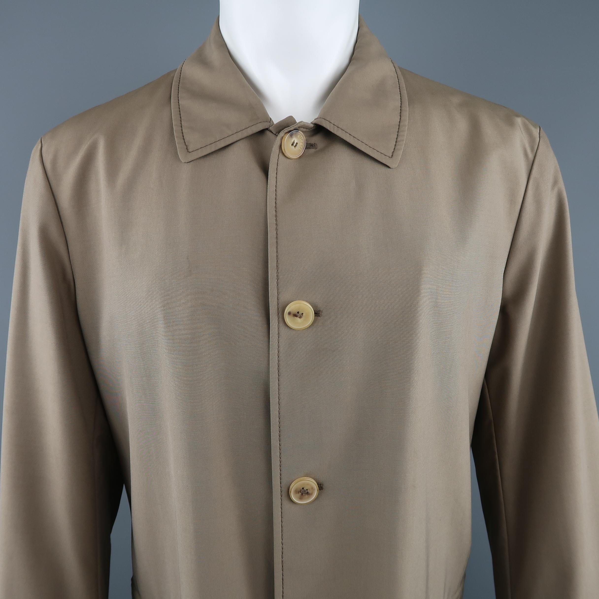 ALLEGRI car coat comes in dark khaki wool blend fabric with a pointed collar, button up front, tab cuffs, and zip pockets. Minor mark on chest. As-is.  Made in Italy.
 
Good Pre-Owned Condition.
Marked: IT 50
 
Measurements:
 
Shoulder: 19