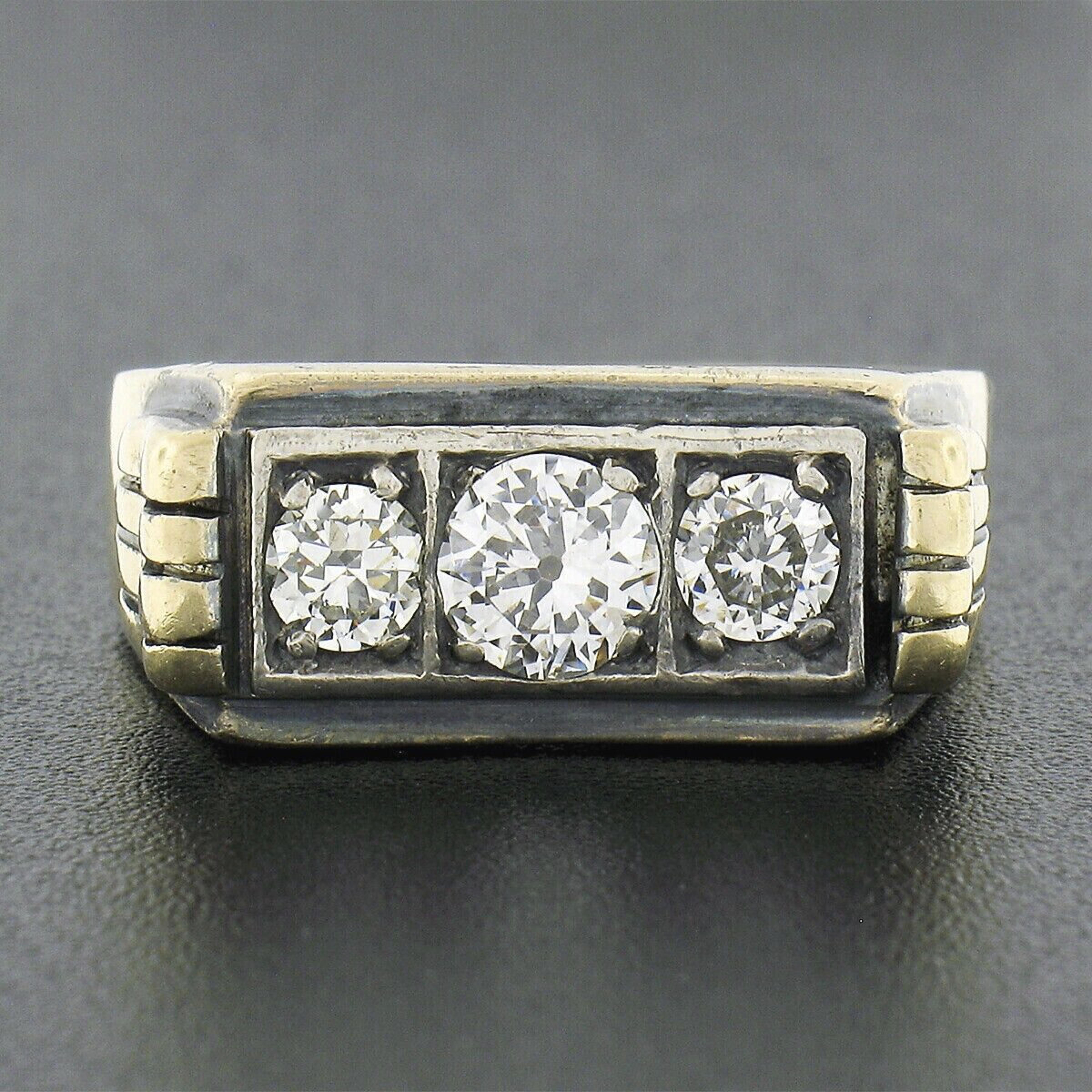 This incredible men's antique band ring was crafted in solid 14k yellow gold and features 3 fine quality old European cut diamonds which are individually pave set in square and rectangular settings across its top, totaling approximately 1.20 carats