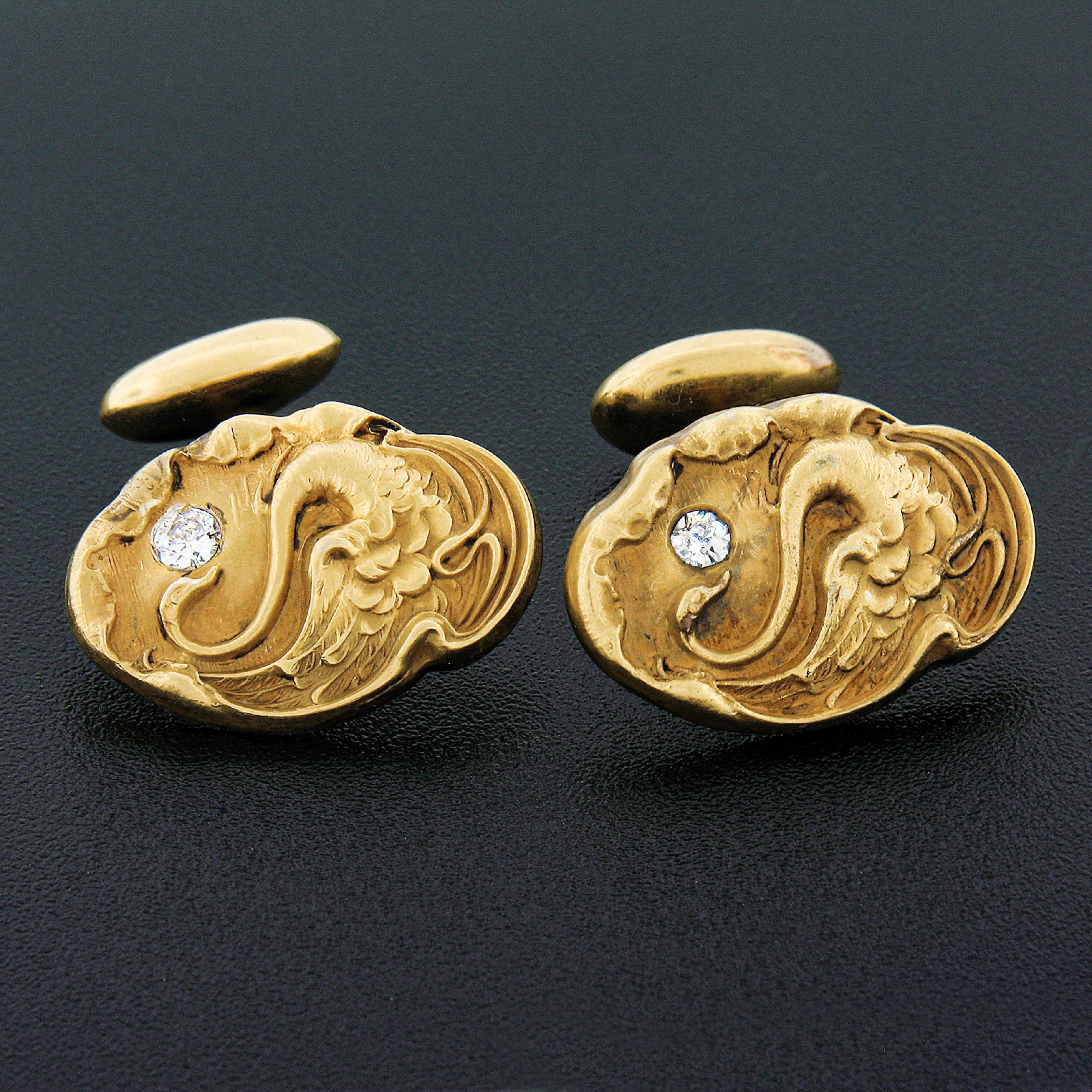 These fine art nouveau period cuff links are crafted in solid 14k yellow gold and feature absolutely spectacular detailing throughout their front panel showing a lovely swan repousse work design that gives the pair a truly outstanding look. Each