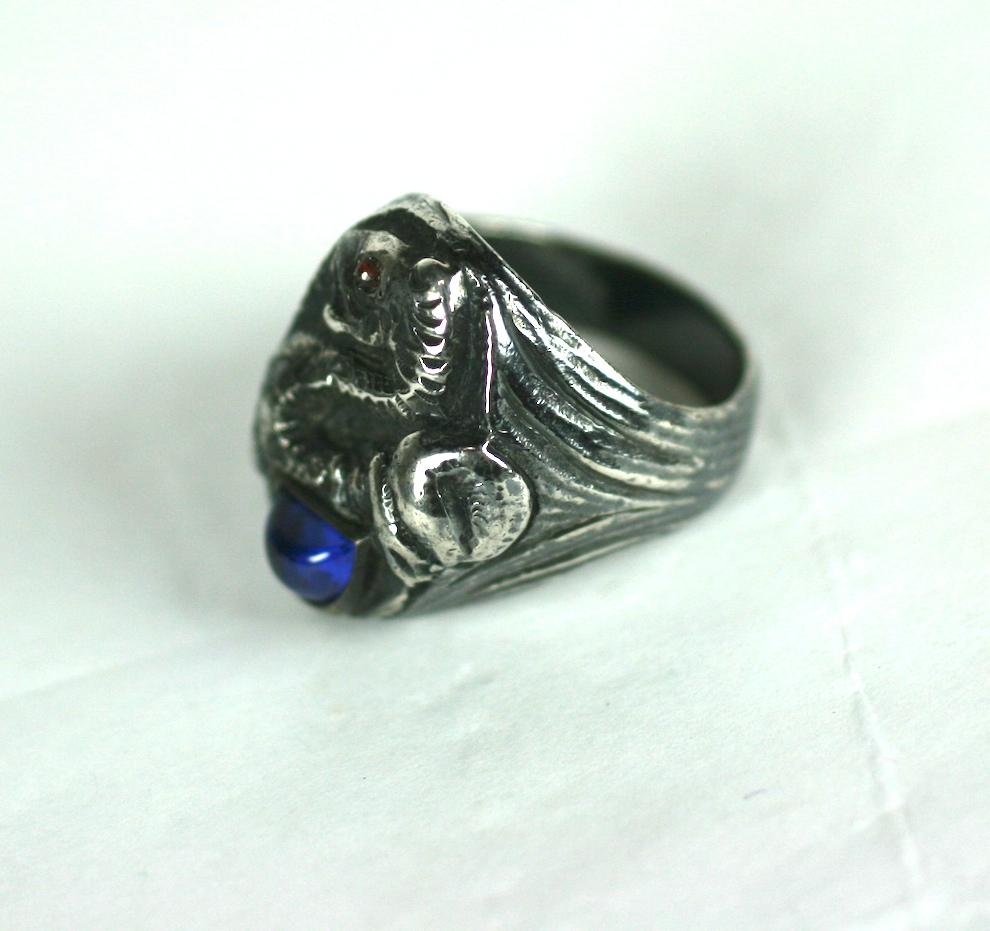 Super cool and unusual Mens Art Deco Sterling signet Ring with snake motif and crescent shaped sapphire glass paste stone and garnet eye.  Very large scale and size.
Super heavy quality weight as well. Great for women as well. 
Large Size 11.5-12.