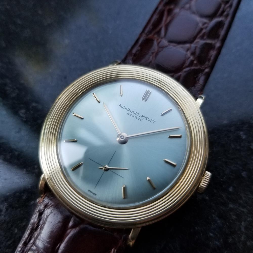 Timeless luxury, men's 18k solid gold Audemars Piguet manual hand-wind dress watch, c.1970s. Verified authentic by a master watchmaker. Gorgeous Audemars Piguet signed sky blue dial, applied indice hour markers, gilt minute and hour hands, subdial