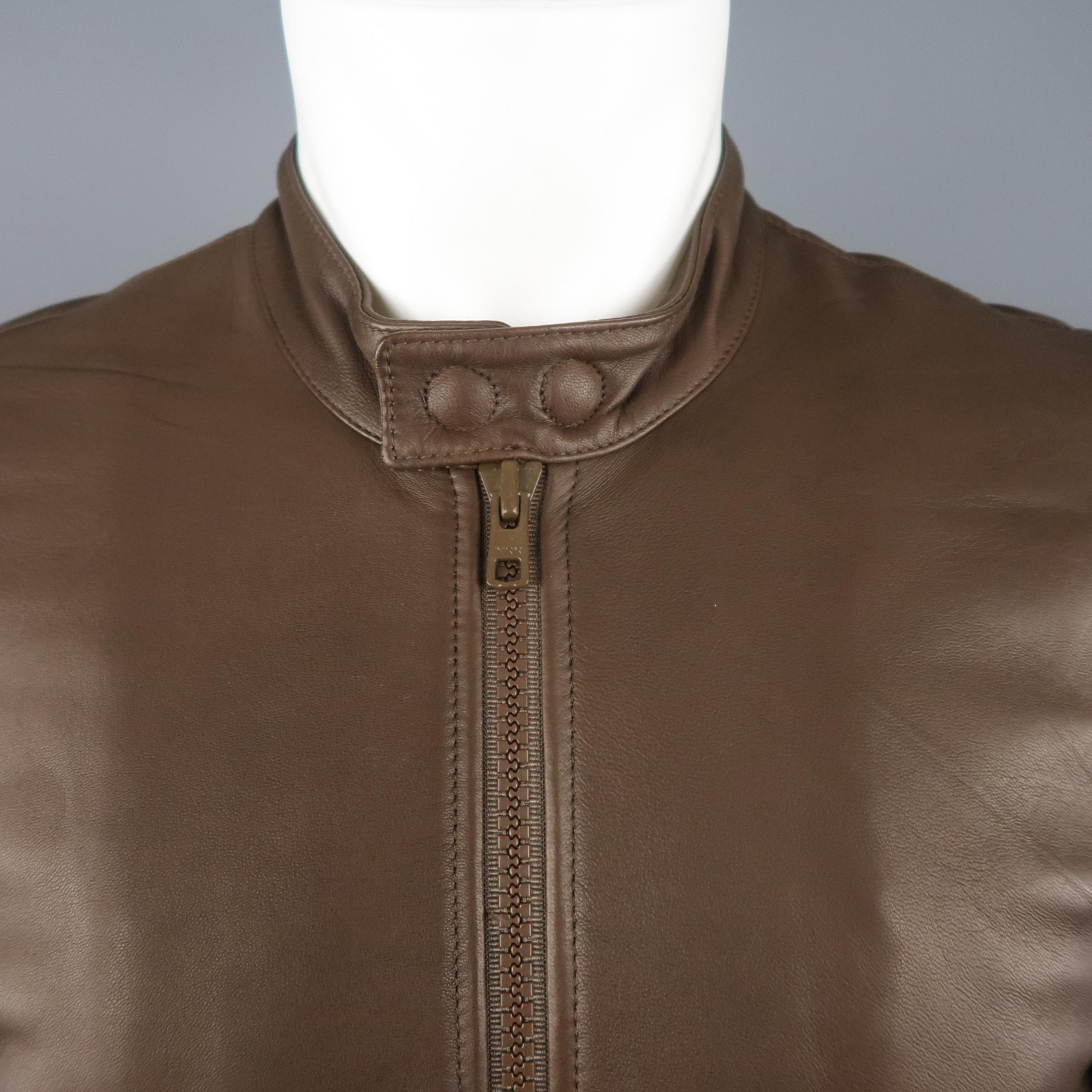BAND OF OUTSIDERS bomber jacket comes in soft brown leather with a snap band collar, brown zip front, flap snap pockets, elbow patches, and ribbed knit waistband and cuffs.  Made in Italy.
 
New with Tags.
Marked: 1
 
Measurements:
 
Shoulder: 17