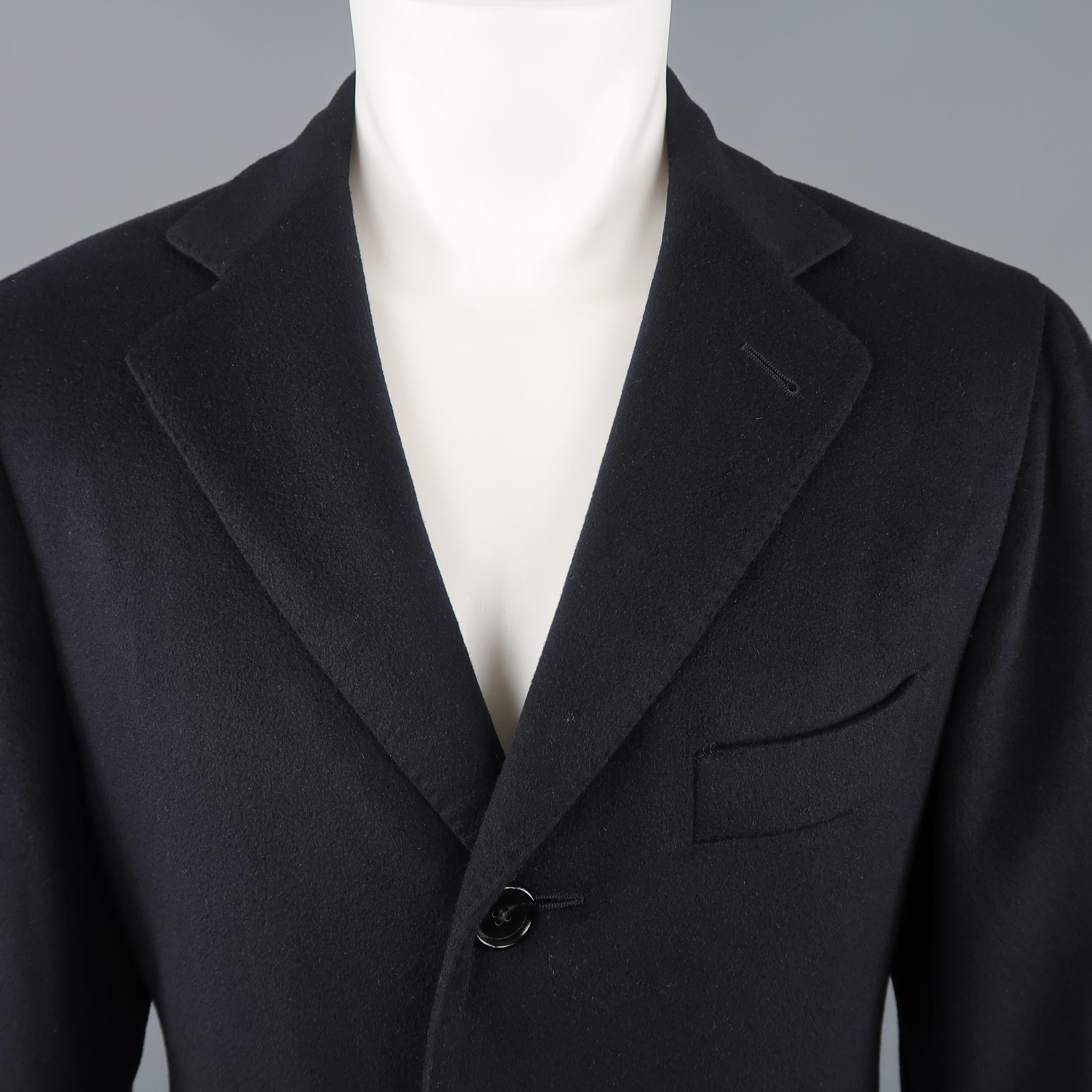 BARNEY'S NEW YORK comes in midnight navy blue LORO PIANA Cashmere with a top stitch notch lapel, single breasted three button front, and flap pockets.
 
Excellent Pre-Owned Condition.
Marked: IT 48
 
Measurements:
 
Shoulder: 17 in.
Chest: 42