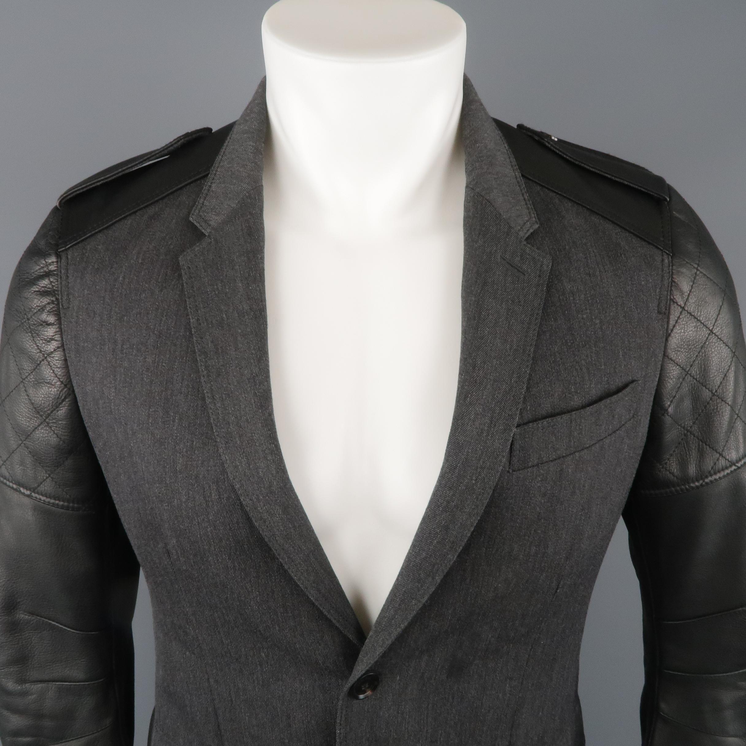 BELSTAFF sport coat jacket comes in gray wool twill with a notch lapel, single breasted two button front, flap snap pockets, and leather biker jacket sleeves with epaulets. Made in Italy.
 
New with Tags.
Marked: IT 48
 
Measurements:
 
Shoulder: 16