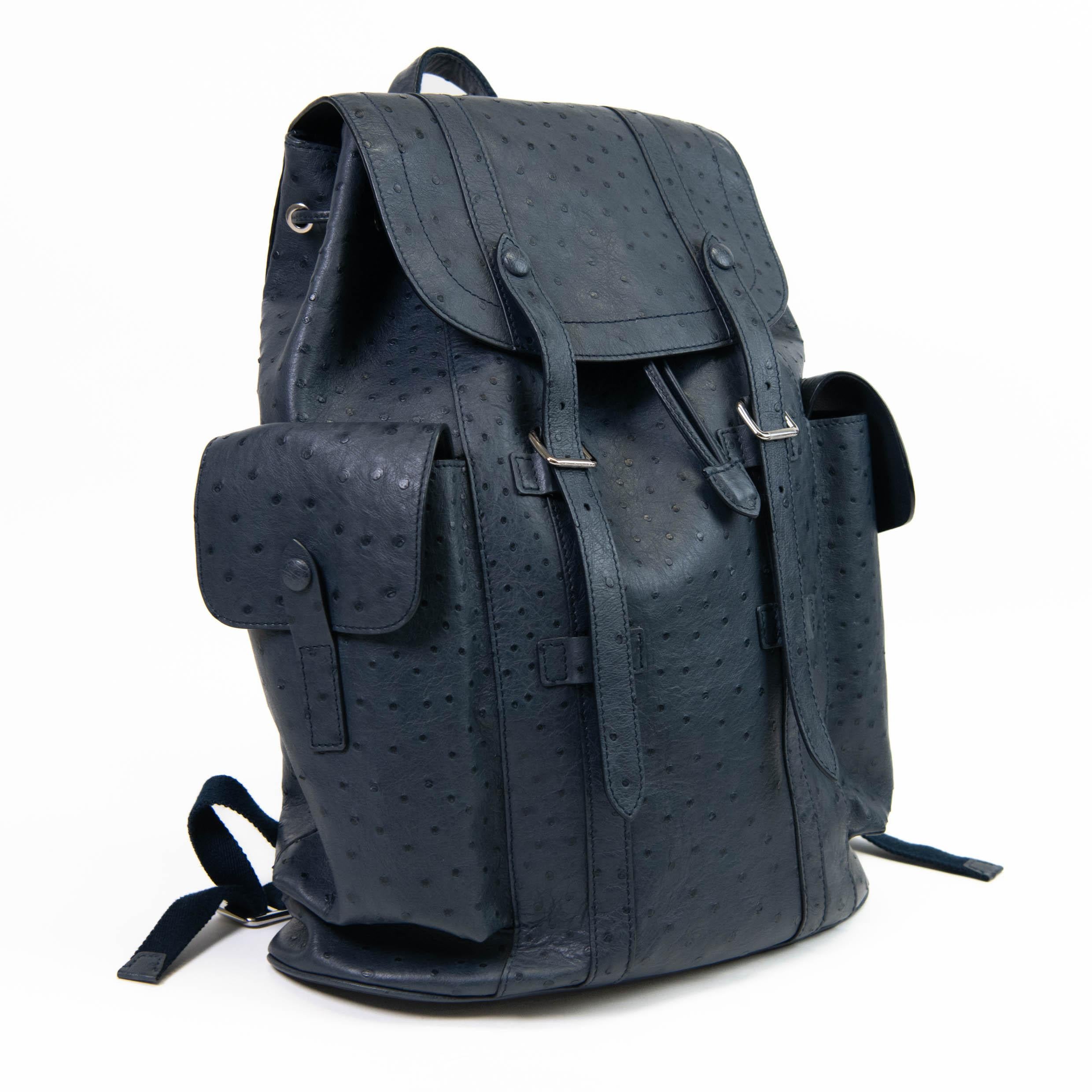 100% Authentic

Men's Blue ostrich Louis Vuitton Christopher backpack with silver-tone hardware, dual adjustable shoulder straps, single flat top handle, dual pockets at exterior with flaps and snap closures, tonal leather interior, five pockets at