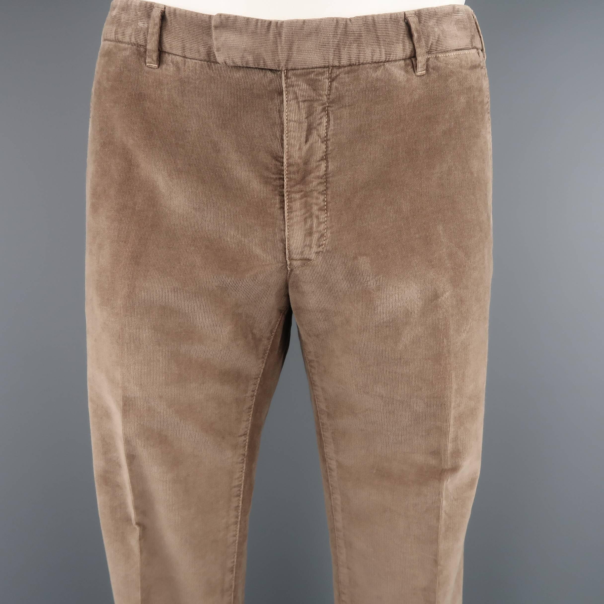 BOGLIOLI pants come in tan corduroy with a flat front, tapered leg. Wear throughout.  Made in Italy.
 
Good Pre-Owned Condition.
Marked: IT 50
 
Measurements:
 
Waist: 34 in.
Rise: 9 in.
Inseam: 34 in.

