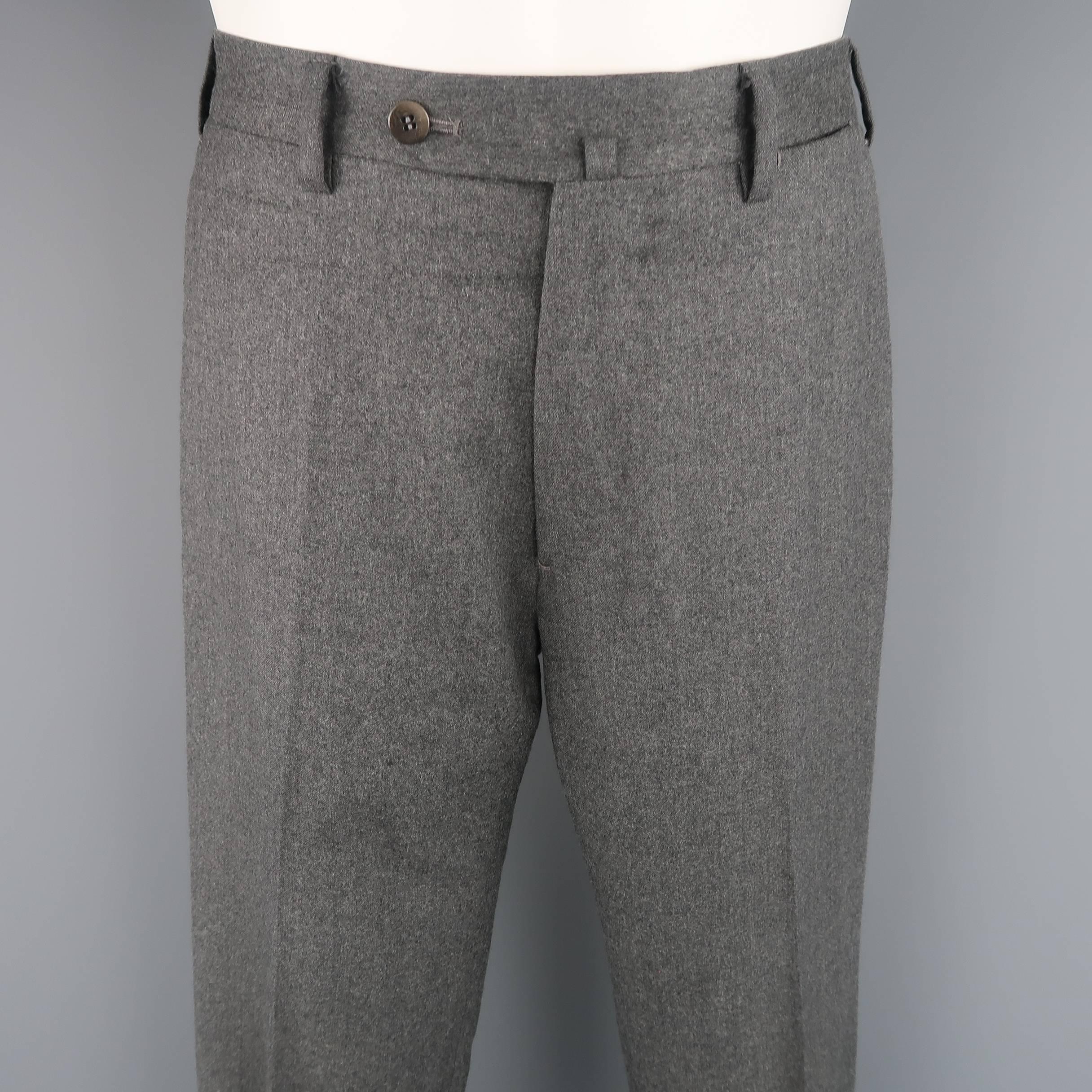 Classic BORRELLI dress pants come in dark heather gray wool with a tapered leg. Made in Italy.
 
Good Pre-Owned Condition.
Marked: IT 48
 
Measurements:
 
Waist: 32 in. (+2 in.)
Rise: 10.5 in.
Inseam: 32 in. (+1.5 in.)
 
(Let Out Room)
