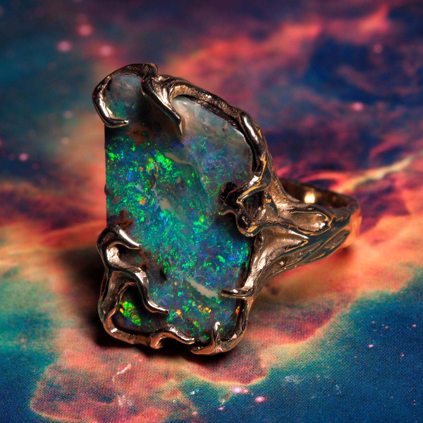 This ring with its magical design and mesmerizing Boulder Opal gemstone will surely make you fall in love with it. Crafted from 14K Gold, this ring reflects the supreme artistic craftsmanship with the Boulder Opal having a gorgeous play of colors