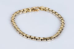 Men’s bracelet in soft 18K yellow and white bicolor gold mesh.