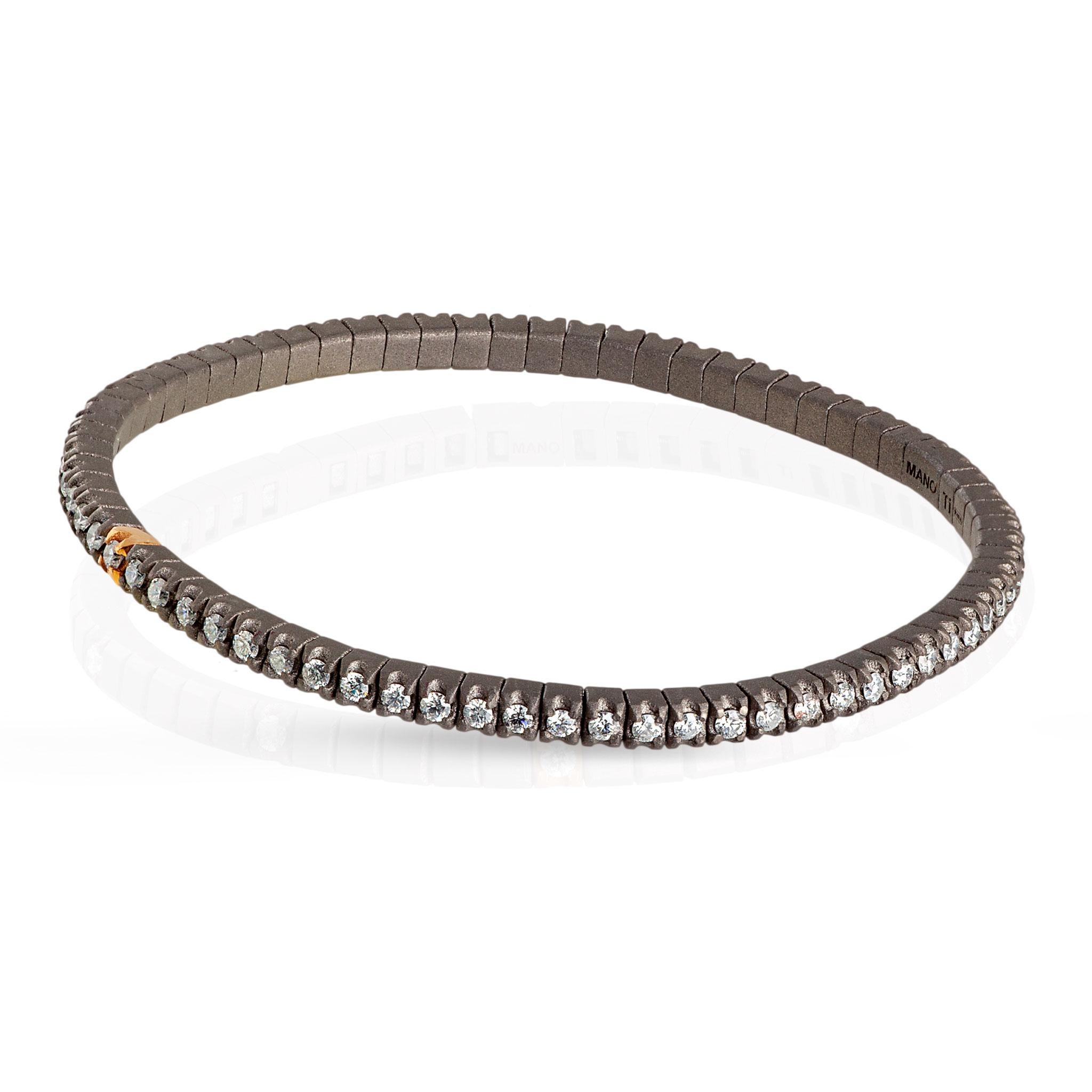 Men's Line Loop bracelet in titanium and white diamonds (ct. 2.15 approx.). The structure consists of an unbroken row of 3-point diamonds set on titanium griffes and one in 18kt red gold placed side by side on an elastic link. This bracelet