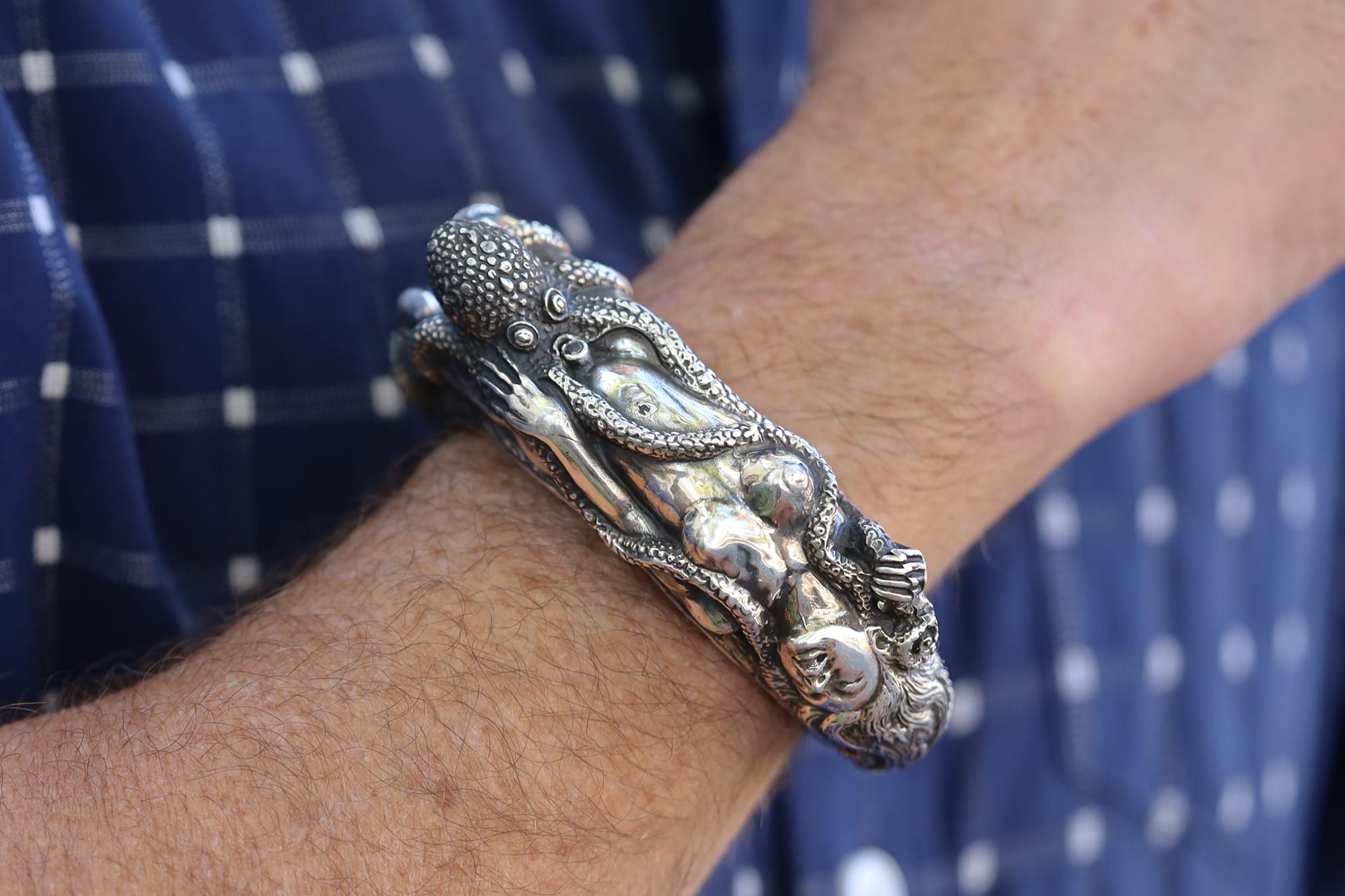 The Dream Of The Fisherman's Wife Cuff, sized for a mens wrist. This very interesting bracelet is themed after an early 19th Century Japanese erotic or shunga print by Hokusai. A large and dynamic bracelet that certainly will draw curious stares.