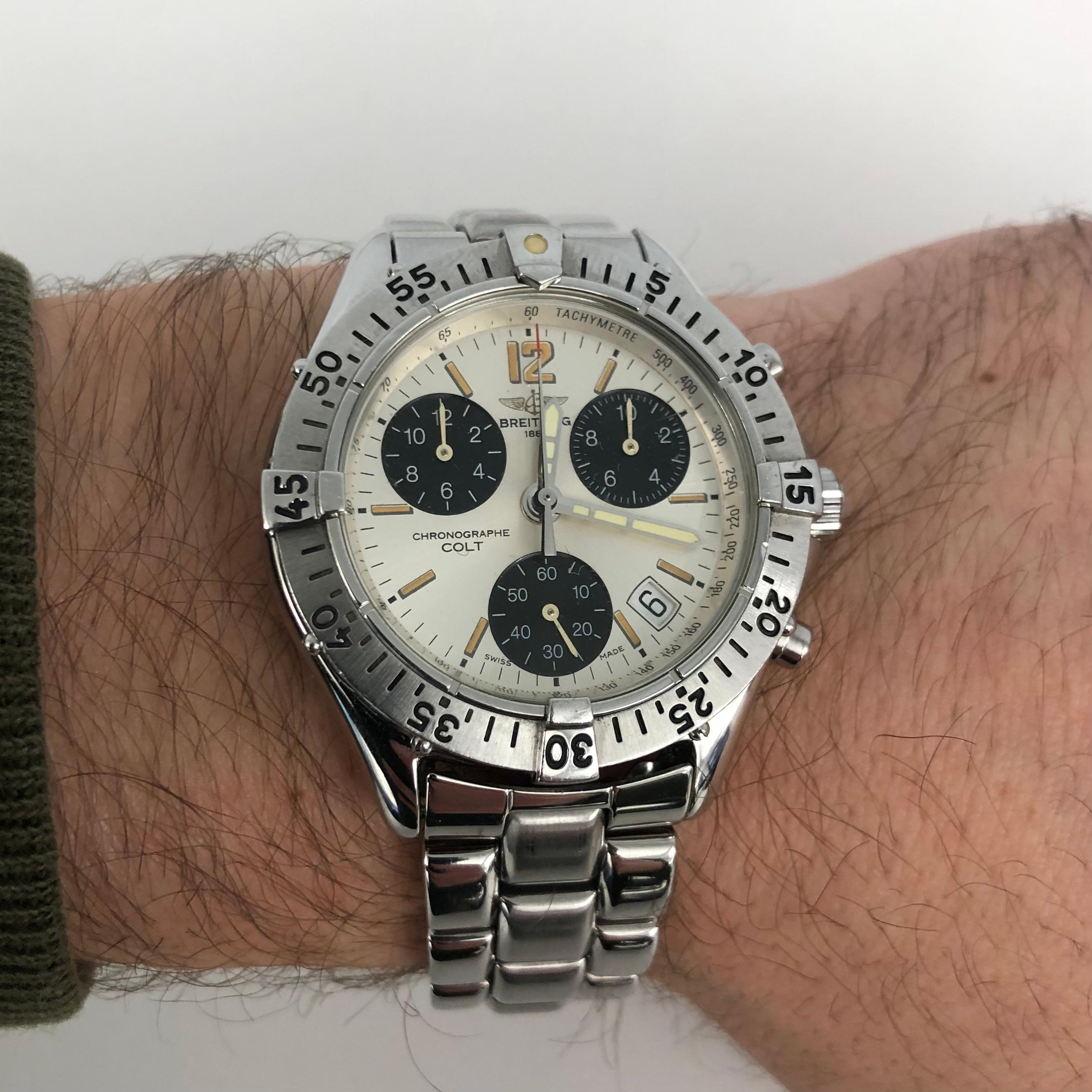 Breitling Men's Colt Chronograph Stainless Steel White Dial Watch A53035.

This 38mm Breitling Colt Chronograph timepiece features a stainless steel case with a unidirectional rotating bezel and a stainless steel bracelet with folding deployment