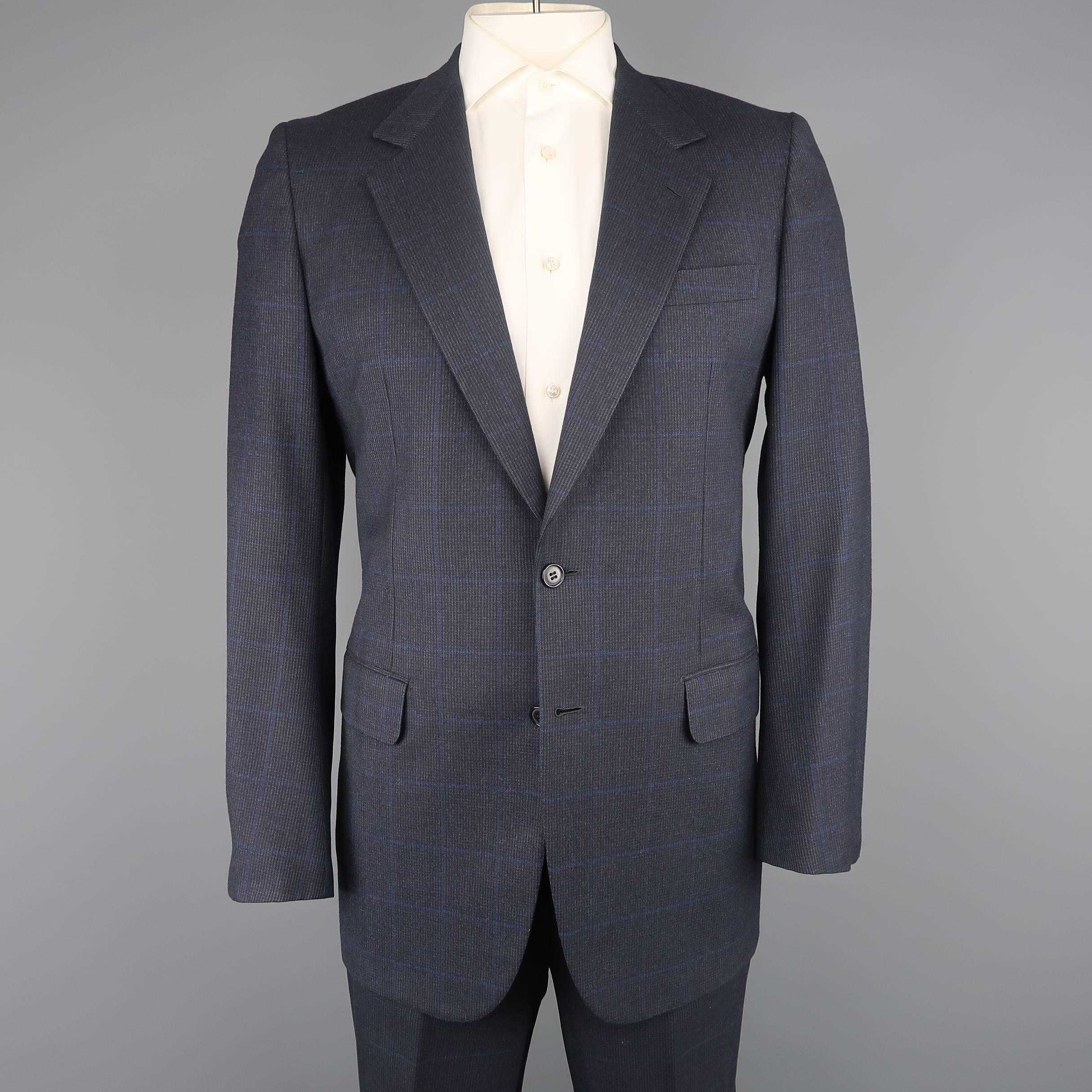 Vintage BRIONI two piece suit comes in navy blue glenplaid wool and includes a single breasted, two button sport coat and pleated trousers. Made in Italy.
 
Good Pre-Owned Condition.
Marked: IT 50
 
Measurements:
 
Jacket
Shoulder: 17 in.
Chest: 42