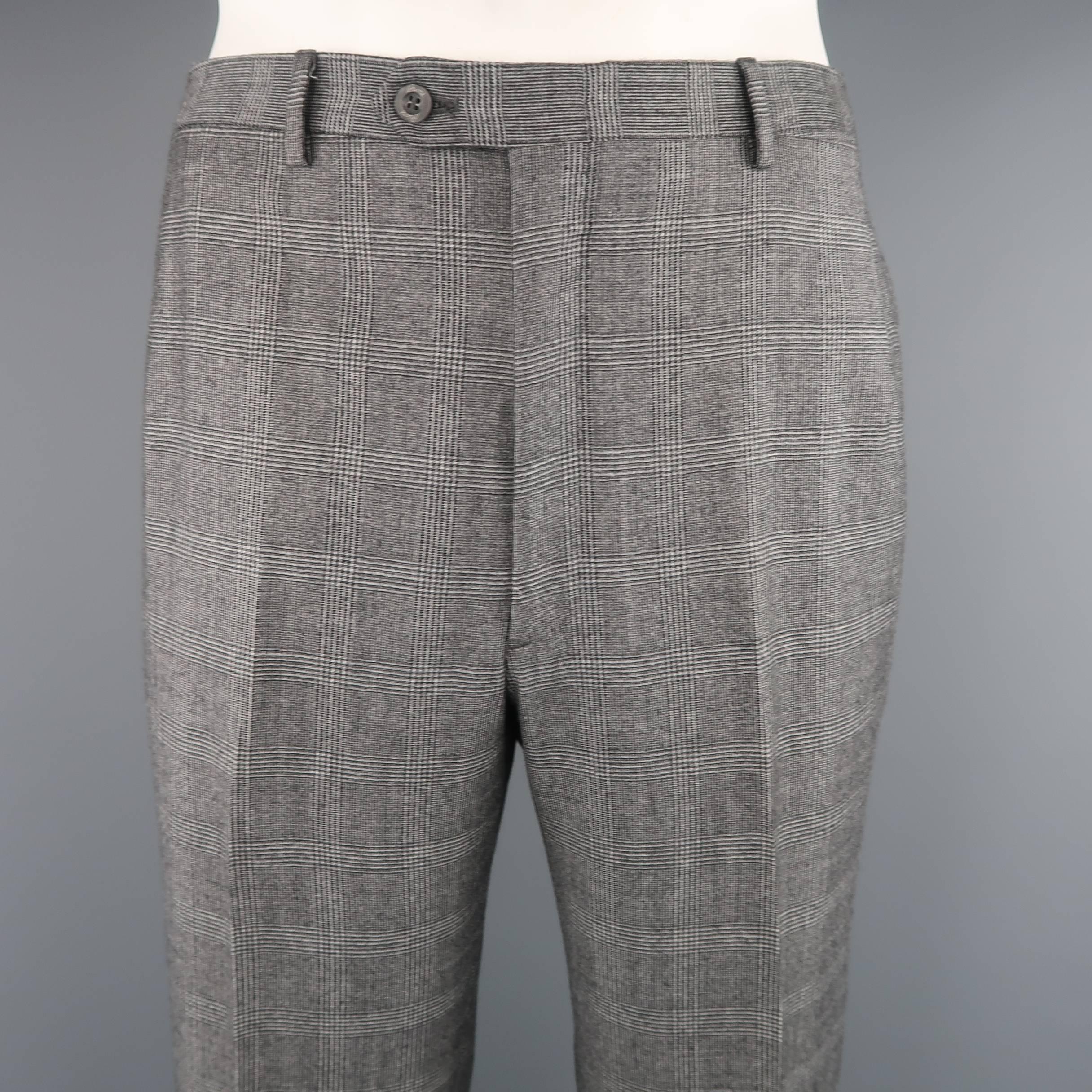 Classic BRIONI dress pants come in gray glenplaid wool blend material with a flat front and cuffed hem. Made in Italy.
 
Excellent Pre-Owned Condition.
Marked: 36 R
 
Measurements:
 
Waist: 34 in. (+2 in. )
Rise: 1.5 in.
Inseam: 31 in.
 
(Let Out
