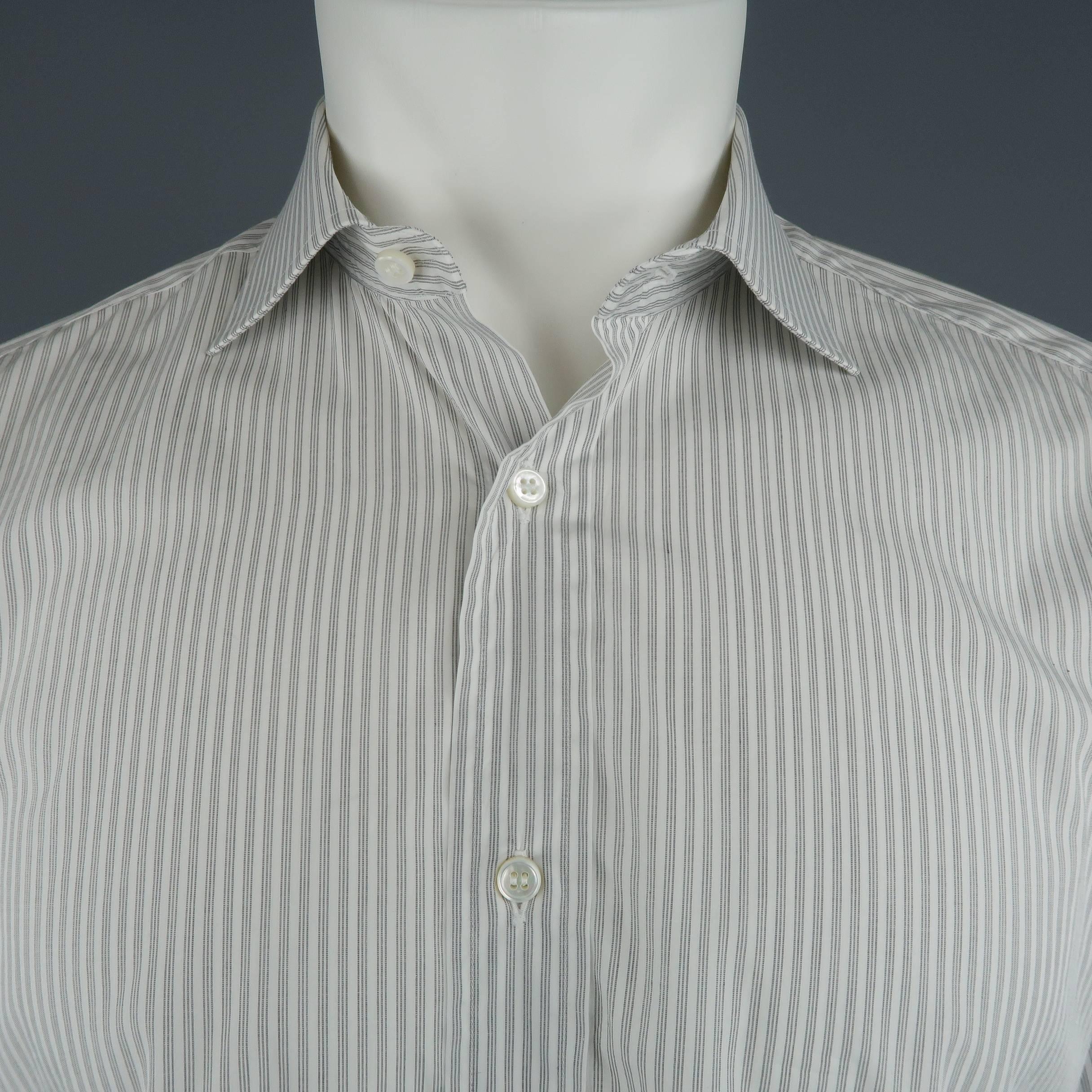 Classic BRIONI dress shirt comes in striped cotton with a spread collar and French cuffs. Cuff links not included. Made in Italy.
 
Good Pre-Owned Condition.
Marked: 39/15.5
 
Measurements:
 
Shoulder: 16 in.
Chest: 46 in.
Sleeve: 24 in.
Length: 31