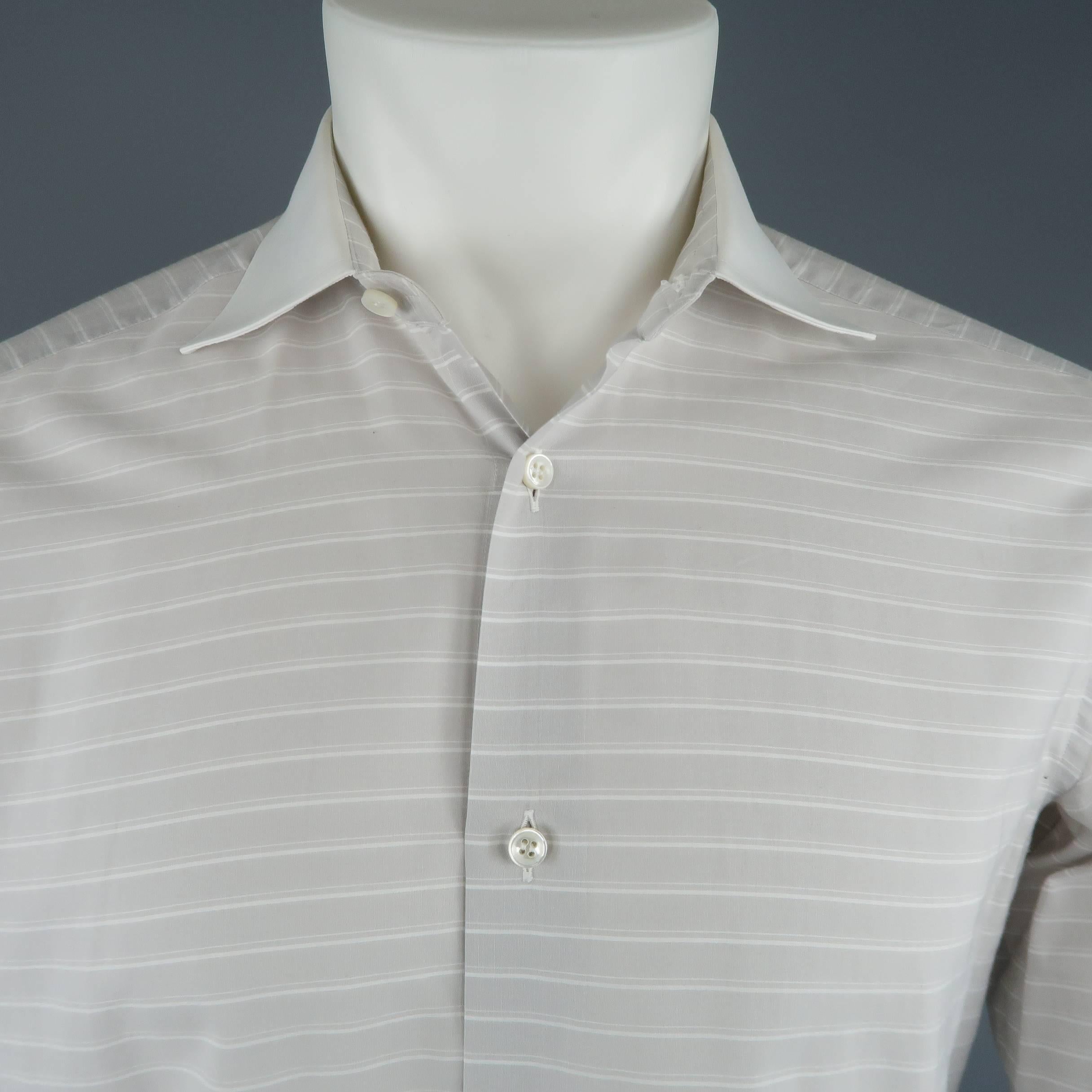 Classic BRIONI dress shirt comes in striped cotton with a spread contrast collar and French cuffs. Cuff links not included. Made in Italy.
 
Good Pre-Owned Condition.
Marked: R 15.5
 
Measurements:
 
Shoulder: 15 in.
Chest: 44 in.
Sleeve: 23