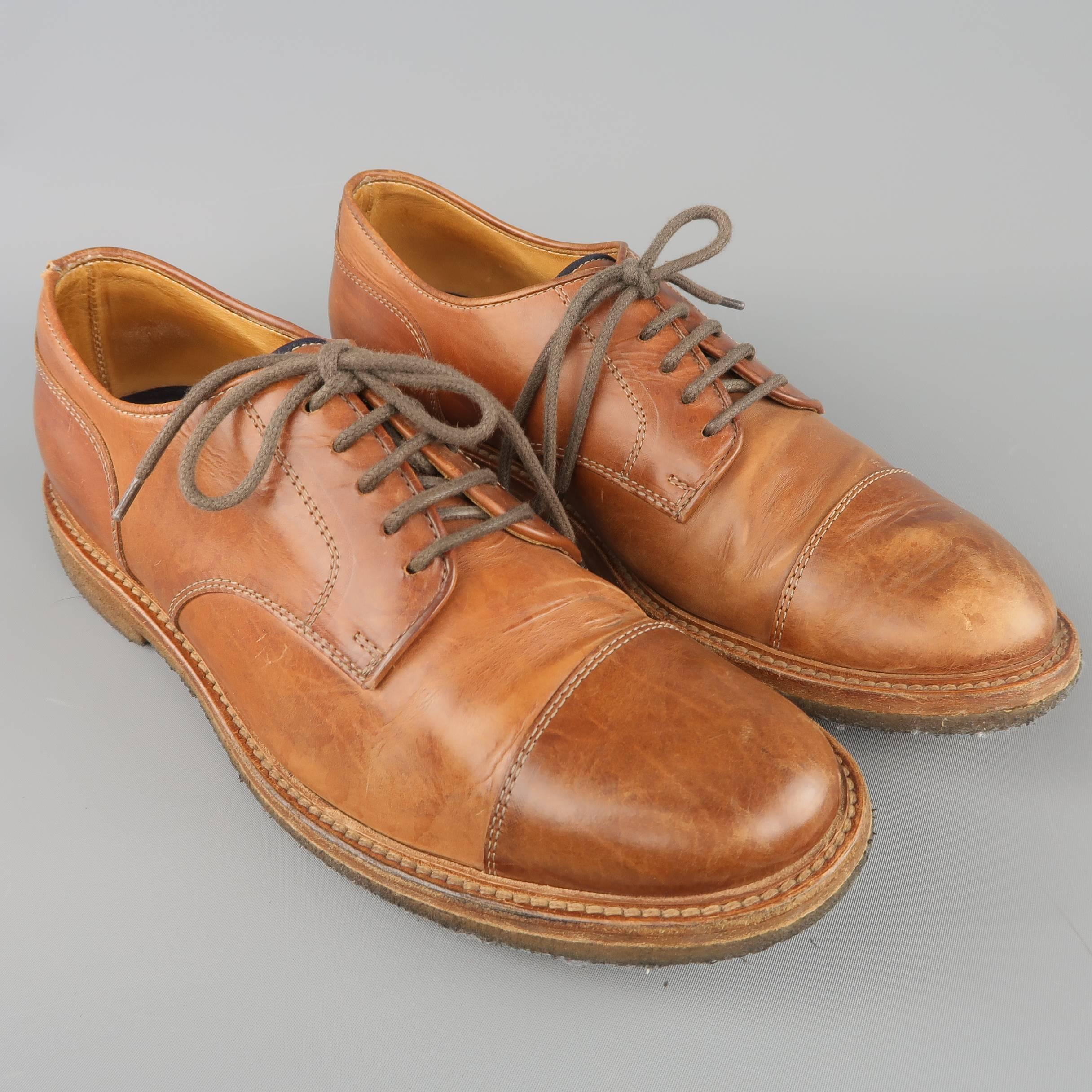 BRUNELLO CUCINELLI dress shoes come in tan leather with a cap toe and crepe sole. Wear throughout. As-is. Made in Italy.
 
Fair Pre-Owned Condition.
Marked: IT 42
 
Outsole: 11.75 X 4.25 in.