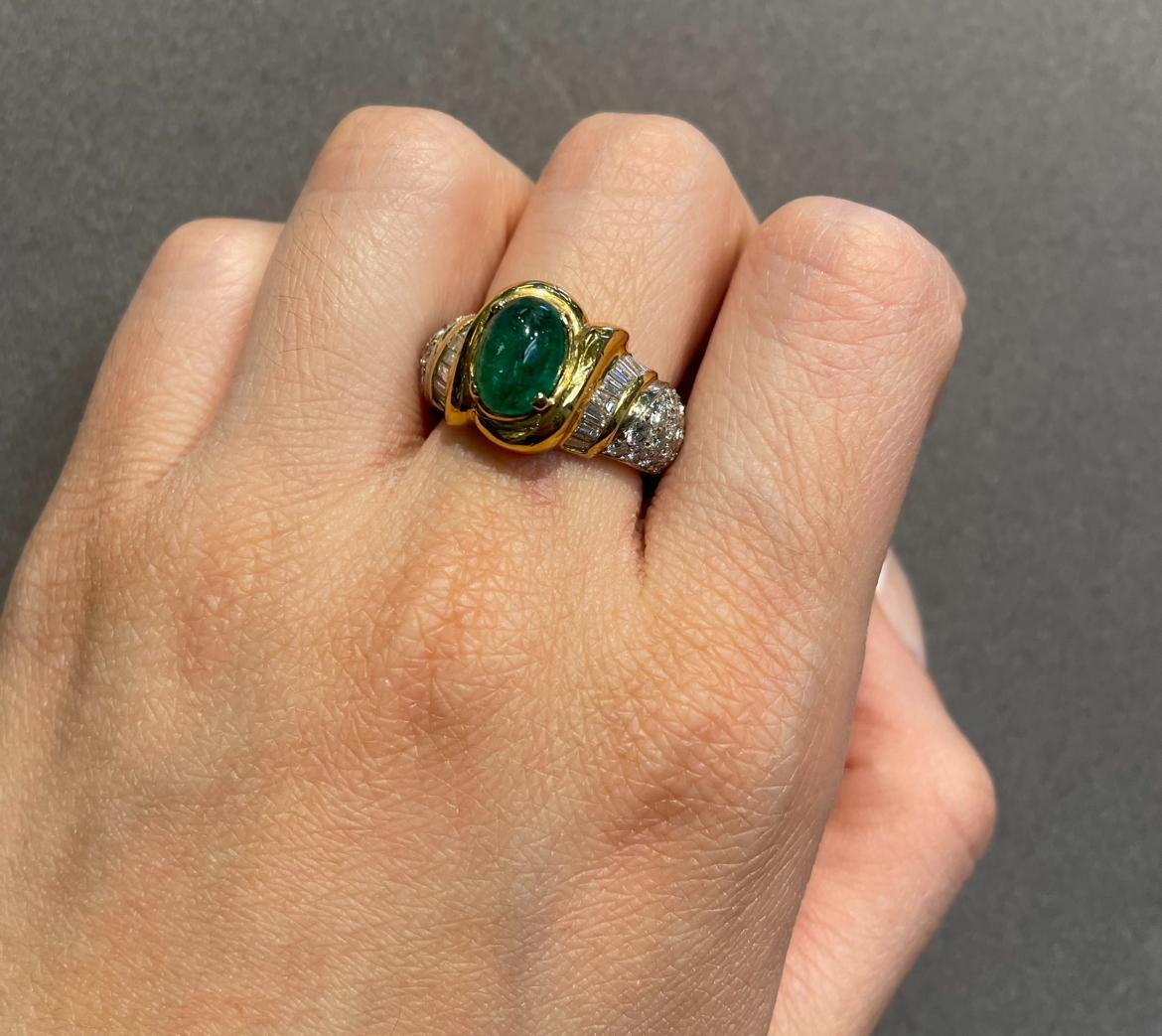 Men's Cabochon Emerald and Diamond Ring by Elan

A yellow gold ring set with a cabochon emerald, accented with 18 baguette cut diamonds and 44 round cut diamonds. 

Approximate Emerald Weight: 2.34 carats 
Approximate Diamond Weight: 2.09 carats