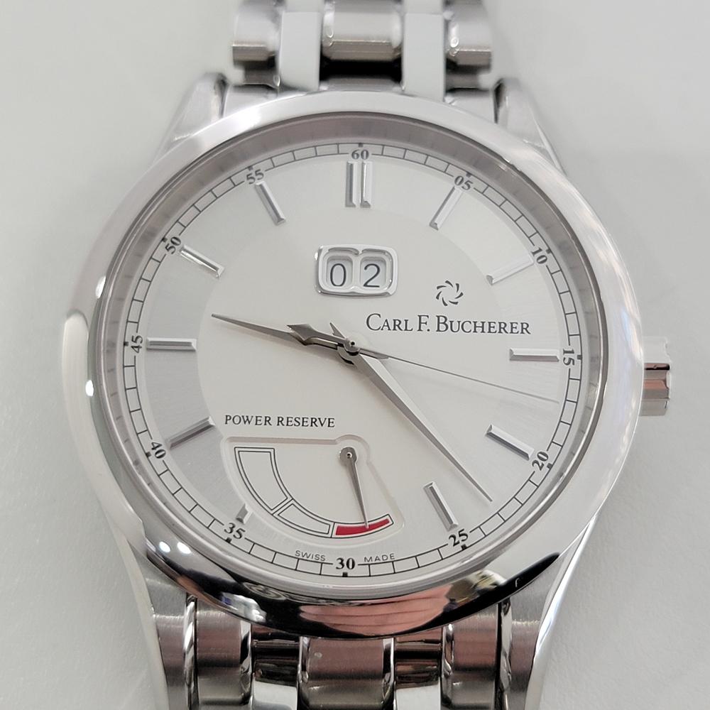 Modern luxury, Men's Carl F. Bucherer Manero Big Date w/power reserve, c.2011, in pristine unworn condition, with original box. Verified authentic by a master watchmaker. Gorgeous silver Carl F. Bucherer signed dial, date display below the 12, power