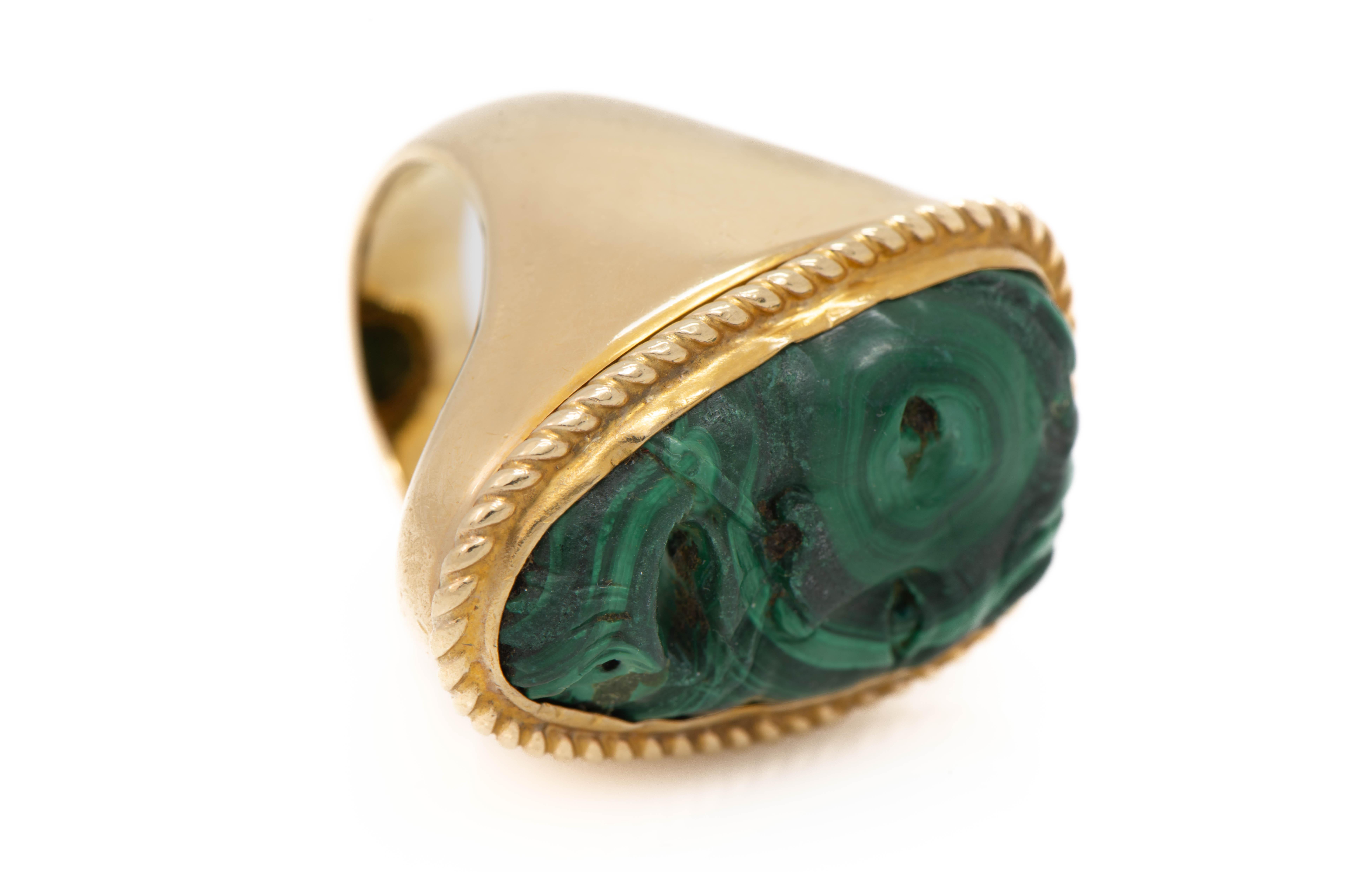 Men's Carved Malachite Gold Ring

A carved malachite face set in 14k yellow gold

Ring Size: 9

Gross Weight: 30.8 grams 