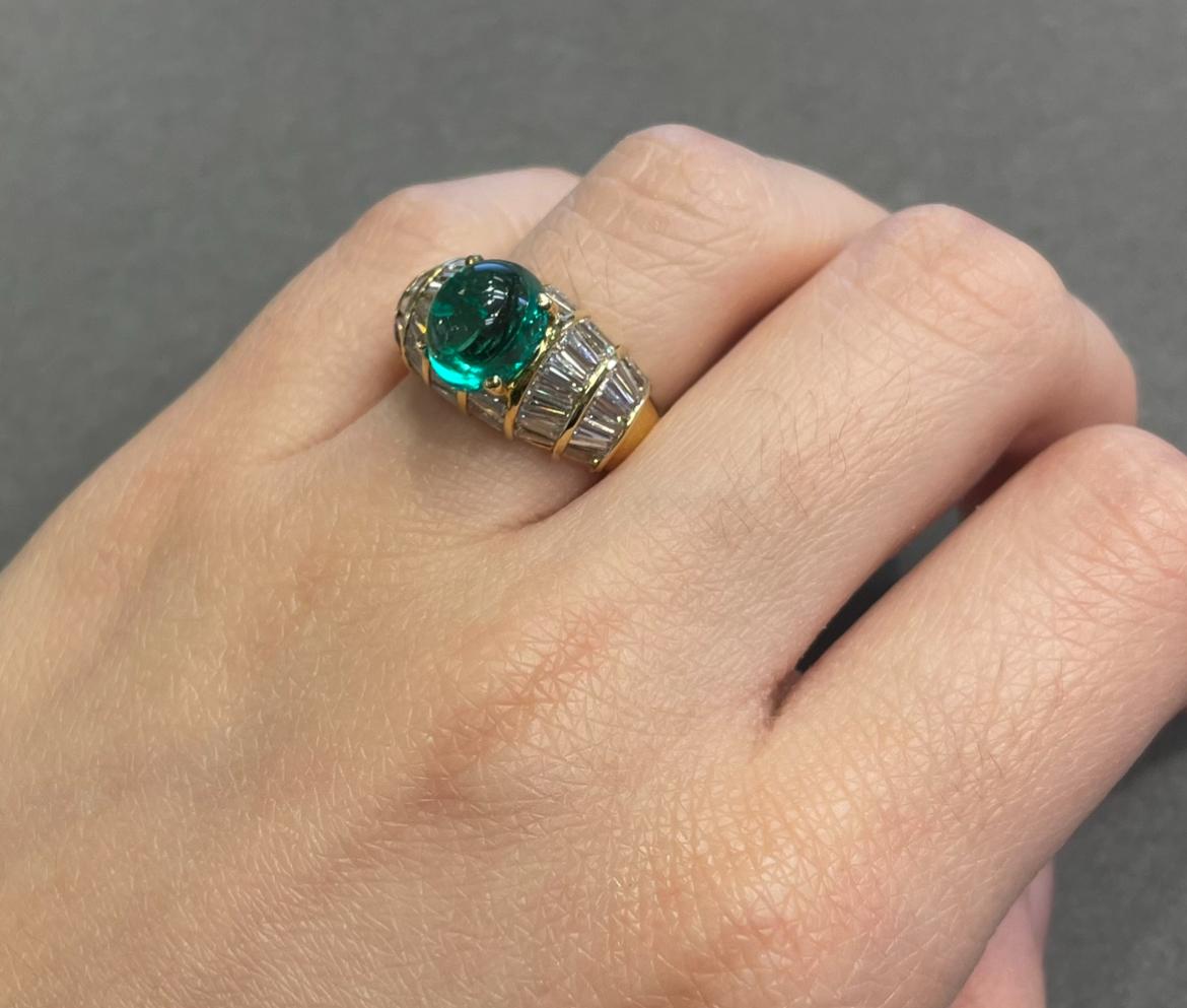 Men's Certified Colombian Cabochon Emerald and Diamond RIng

A yellow gold ring adorned with a cabochon emerald and adorned with baguette-cut diamonds. 

Accompanied by AGL certificate stating Emerald is of Colombian origin. 

Ring Size:
