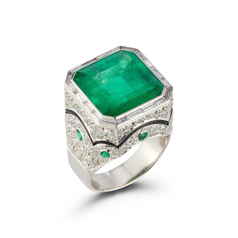 Men's Certified Colombian Emerald and Diamond Ring 

1 emerald cut emerald approximately 12.7 cts with baguette & round cut diamonds,  emeralds & black enamel set in platinum

Ring Size: 8.5

Resizable

Accompanied with AGL certificate 

