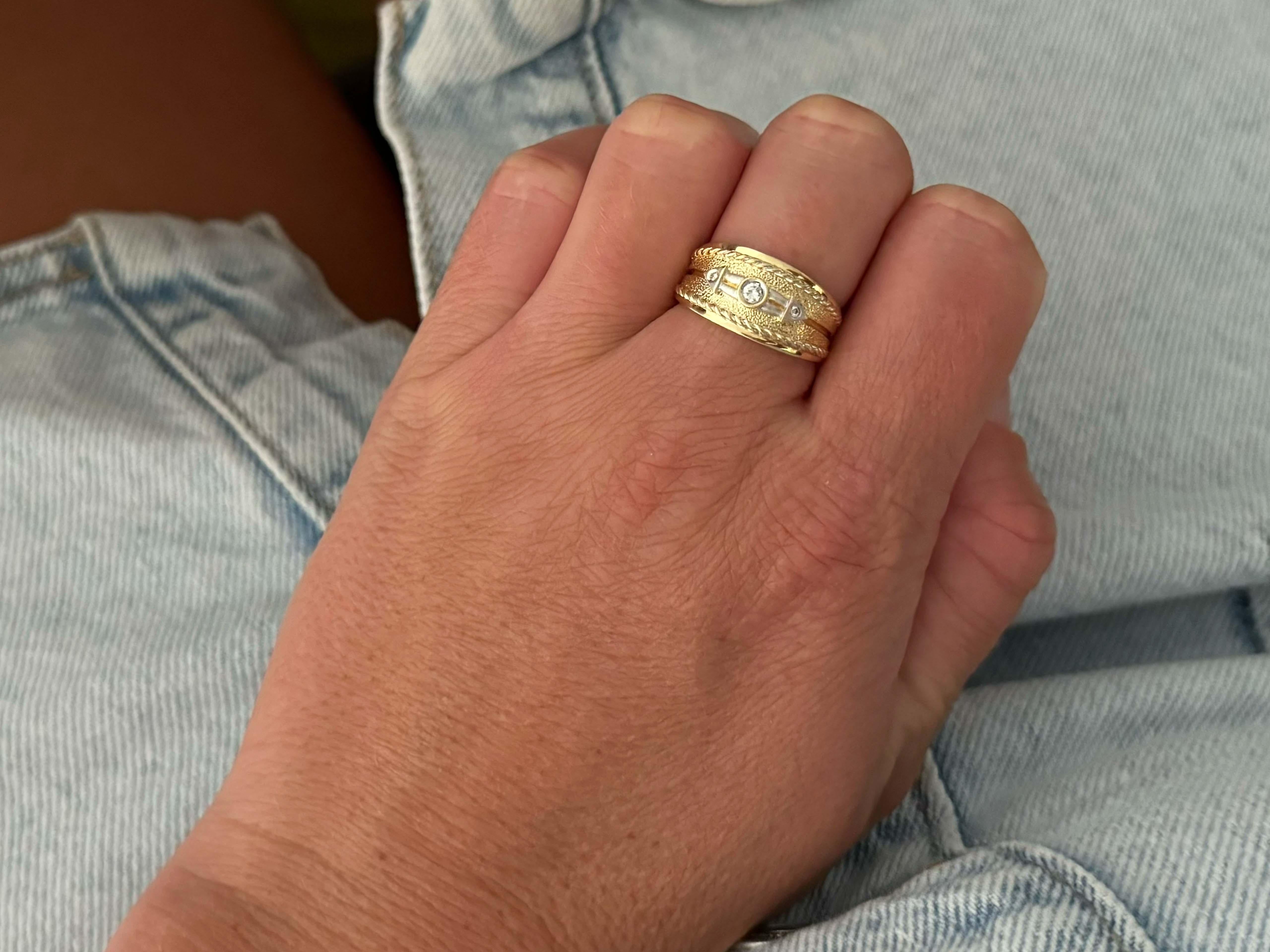 Item Specifications:

Metal: 14k Yellow Gold

Diamond Count: 3 brilliant cut

Total Diamond Carat Weight:  0.10 carats 

Diamond Color: H-J

Diamond Clarity: VS2-SI1

Ring Size: 7.25
​
​Ring Height: 10.3 mm tall

Total Weight: 5.4 Grams

Stamped: