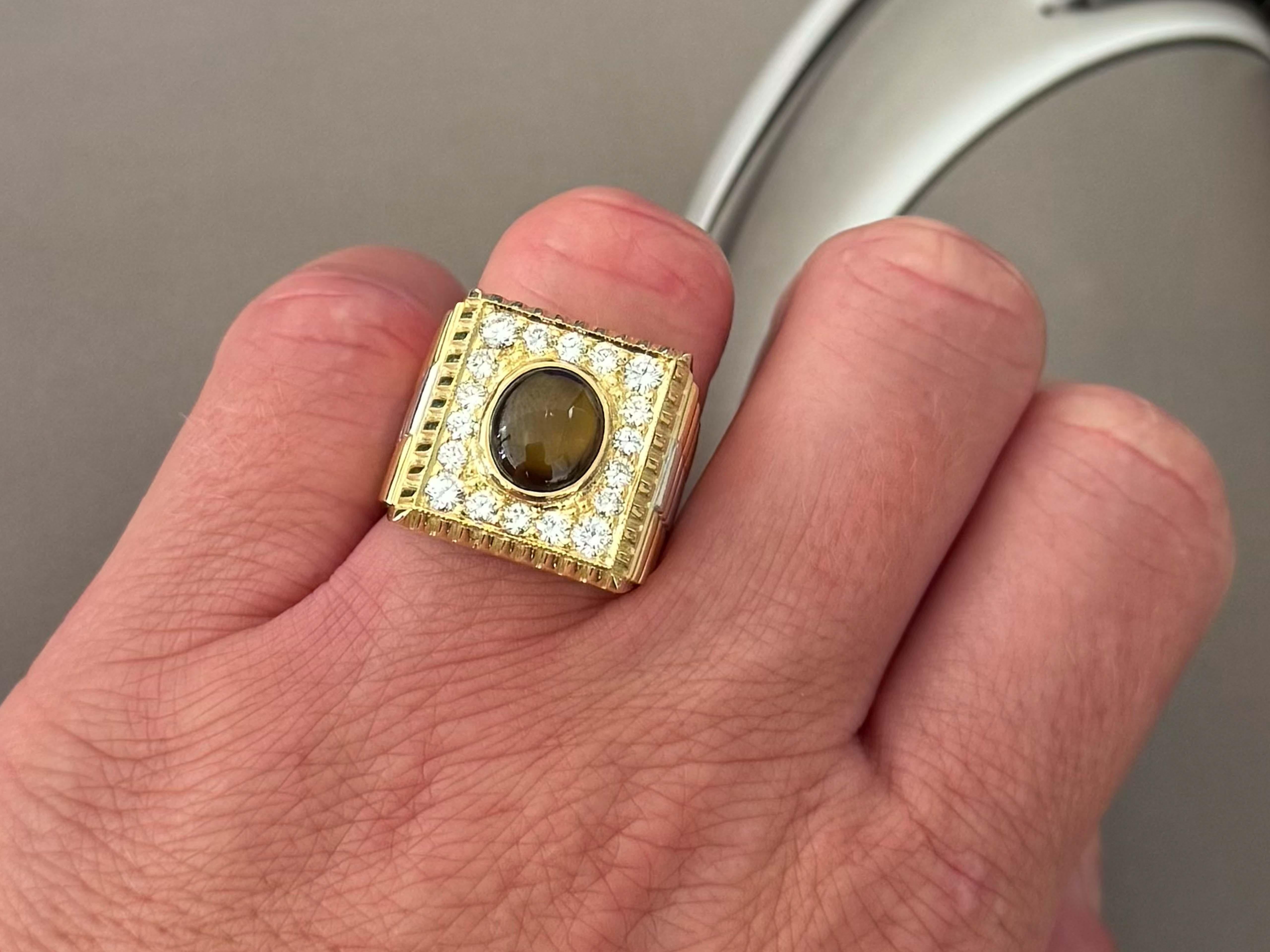 Item Specifications:

Metal: 18k Yellow Gold

Ring Size: 8

Total Weight: 18.1  Grams

Center Stone: Roundish Oval Cabochon Star Sapphire 

Star Sapphire Measurements: 9mm x 8mm x 3.9 mm

Star Sapphire Carat Weight: ~3.00 Carats

Diamond Count: 18