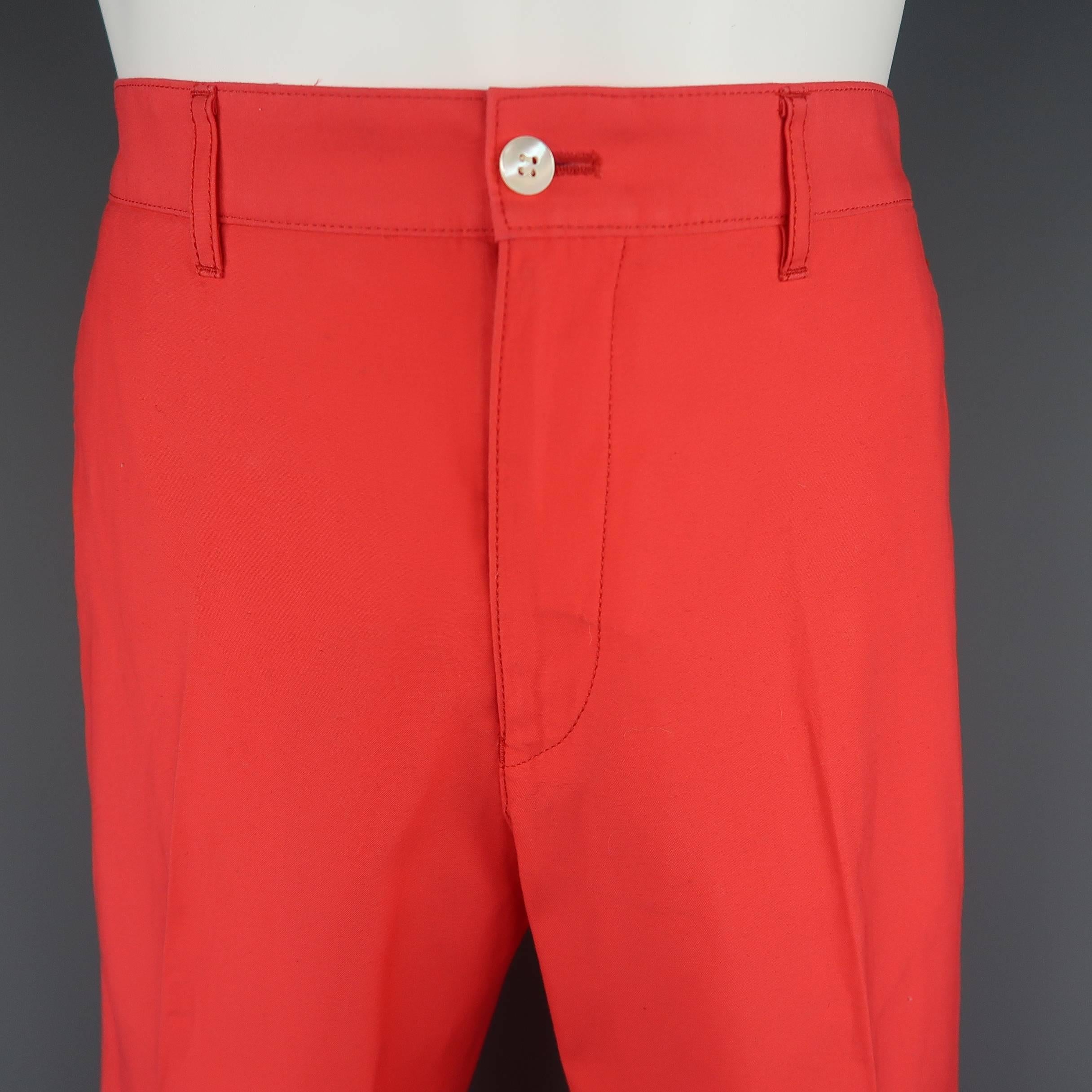 COMME des GARCONS HOMME PLUS chinos come in a bright coral pink cotton canvas with a zip fly and plaid waistband liner. S[ring 2012 Collection. Made in Japan.
 
Excellent Pre-Owned Condition.
Marked: L (AD 2012
 
Measurements:
 
Waist: 34 in.
Rise: