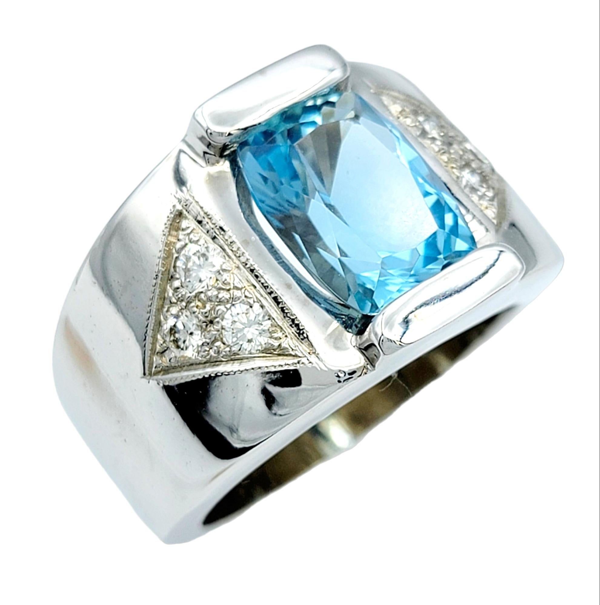 Ring Size: 11.5

Indulge in the timeless allure of this 14 karat white gold cigar band ring, an exquisite piece that seamlessly fuses vintage style charm with contemporary elegance. At its heart lies a rectangular cushion-cut aquamarine, its