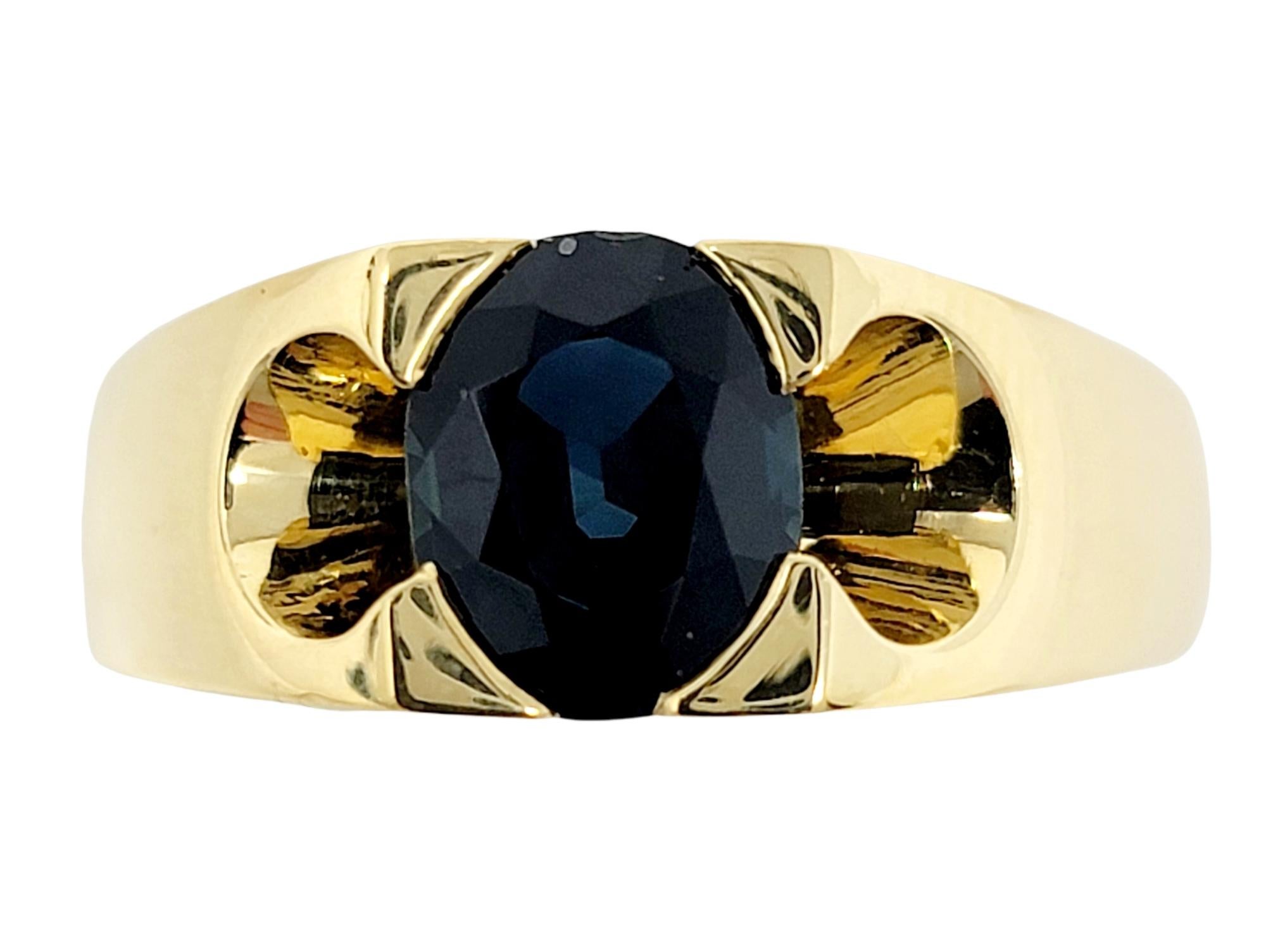 Ring size: 11

Handsome men's band ring with a gorgeous dark blue solitaire sapphire stone. The sleek, polished gold pairs beautifully with the deep blue stone, and has a nice weight on the finger. 

Ring Style: Solitaire
Metal: 18 Yellow Gold
Ring