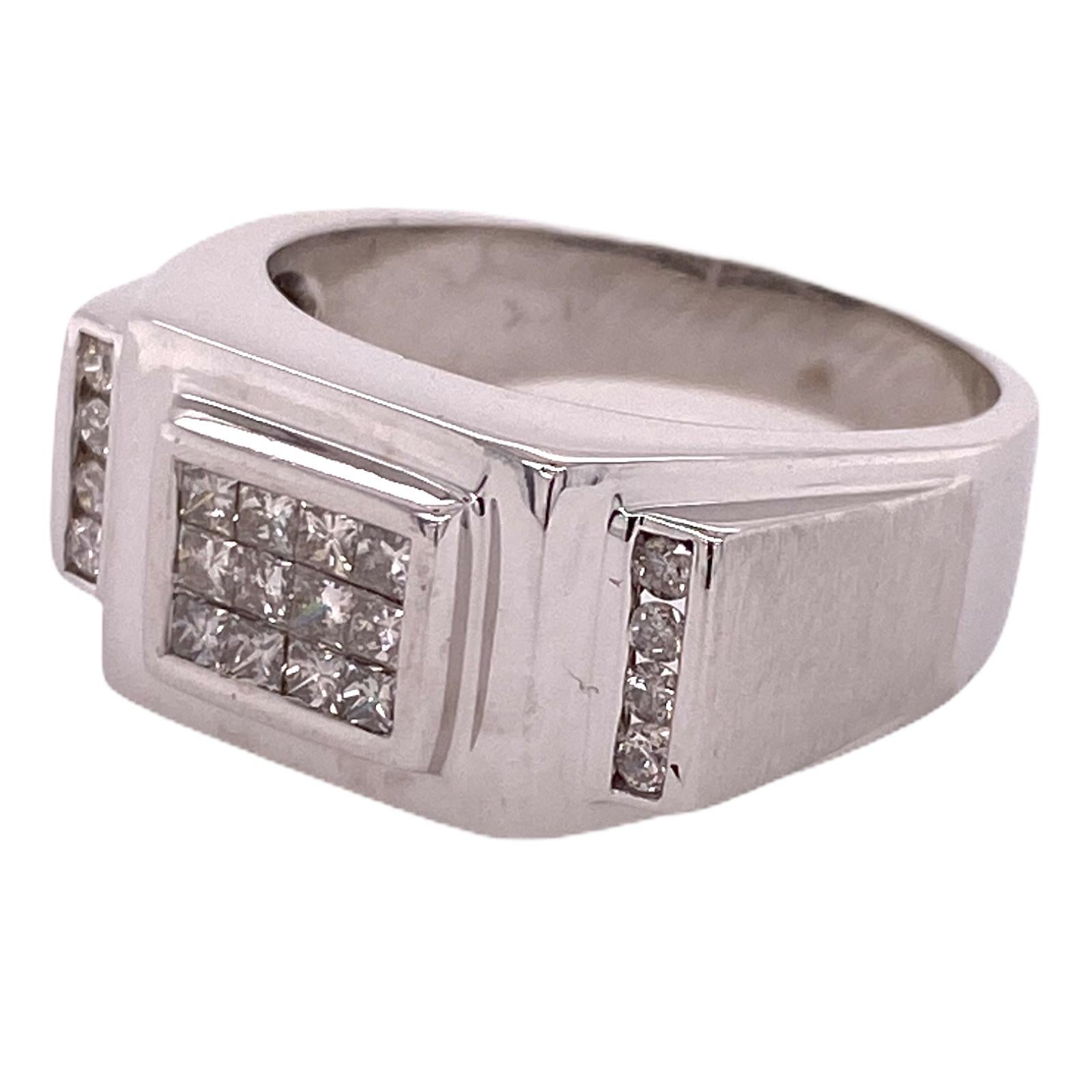 Men's diamond ring fashioned in 14 karat white gold. The ring features 12 princess cut invisibly set diamonds weighing .36 ctw and 8 round brilliant cut channel set diamonds weighing .16 ctw. The diamonds are graded H-I color and SI clarity. The
