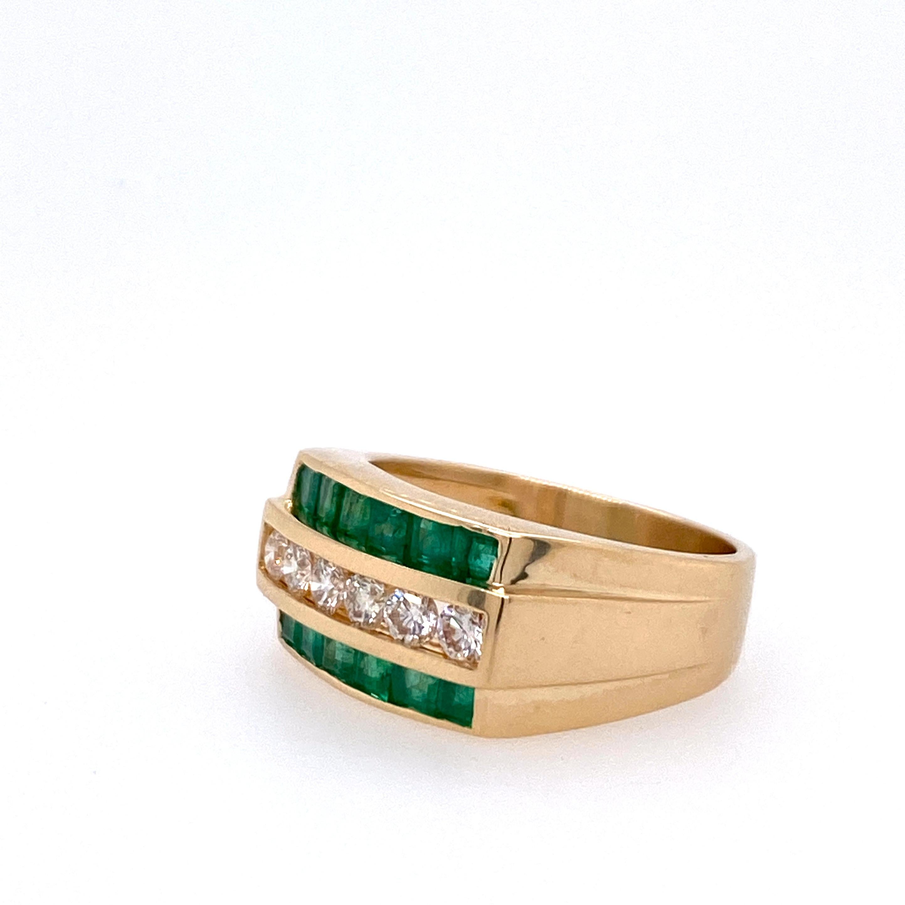 One 14 karat yellow gold men's ring channel set with twelve square step cut emeralds, approximately 1.25 carat total weight with a single row of six channel set round brilliant diamonds, approximately 0.25 carat total weight with matching H/I color