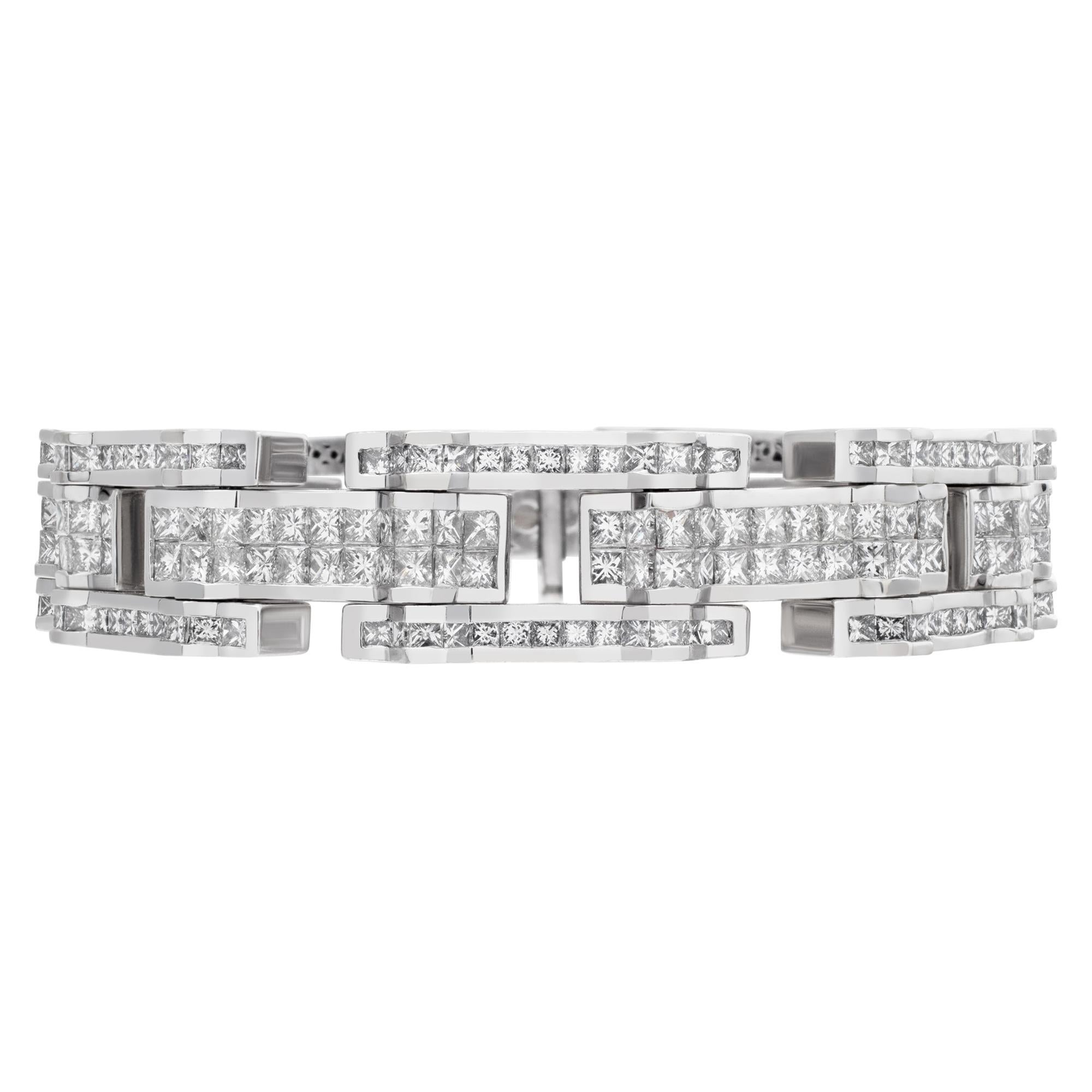 Heavy and bright bracelet in channel and invisibly set princess cut G-H color, VS-SI clarity diamonds on 18k white gold bracelet. Measures 7.75 inches.