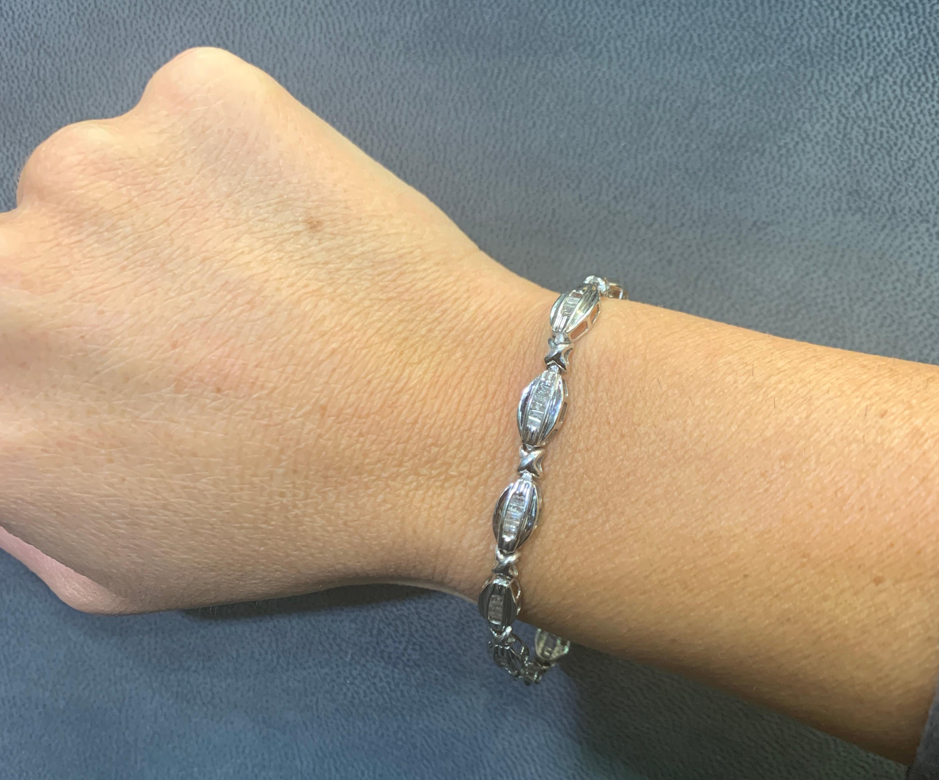 Men's Diamond Bracelet

A bracelet featuring baguette cut diamond links approximately 1.00 carats.

Measurements: 7