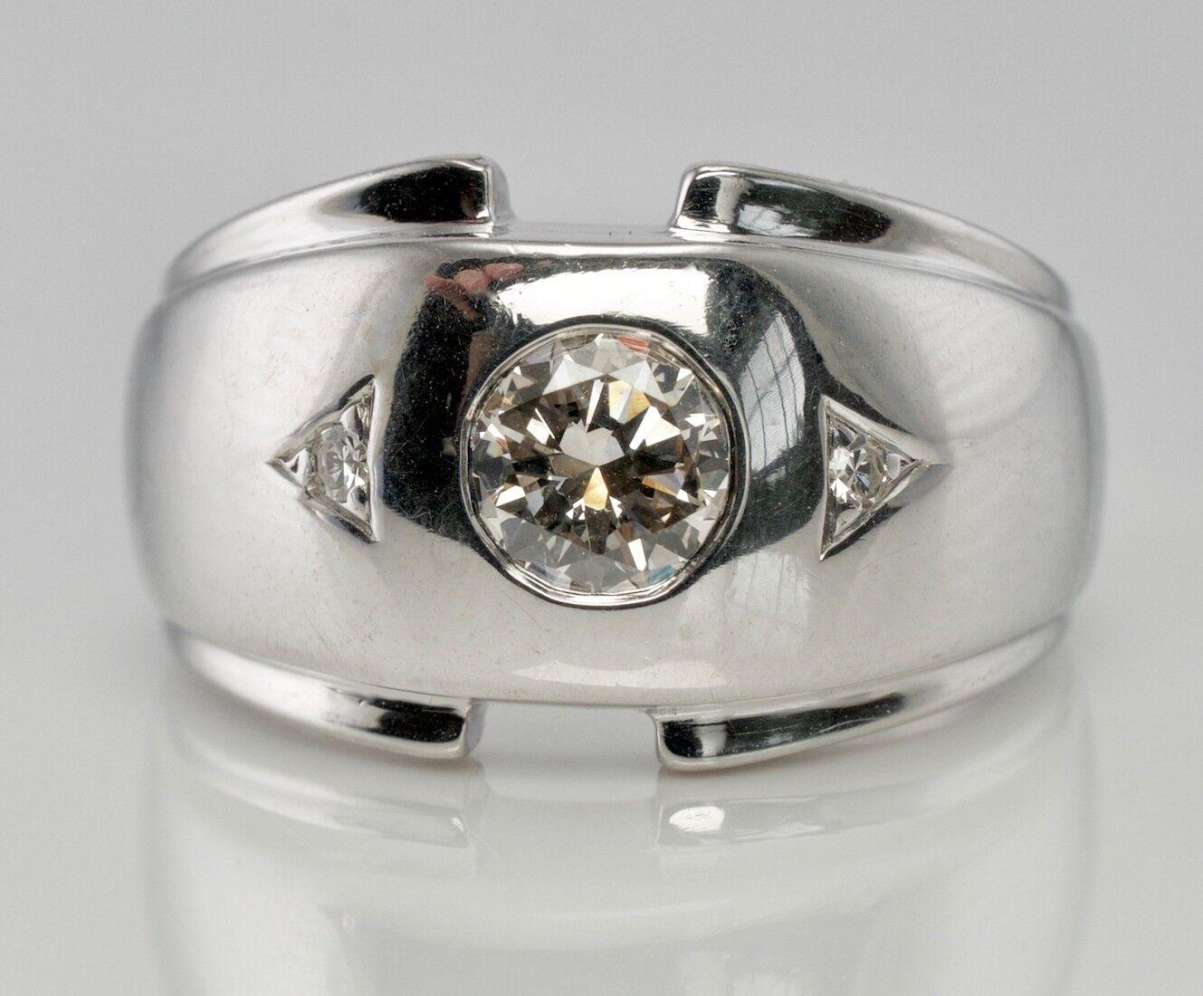This beautiful estate ring for a man is finely crated in solid 14K White gold and set with Diamonds. The center .60ct Diamond is very clean VS2 clarity and I color. Two side round single cut diamonds add .02 carat to the total weight. 
The top of