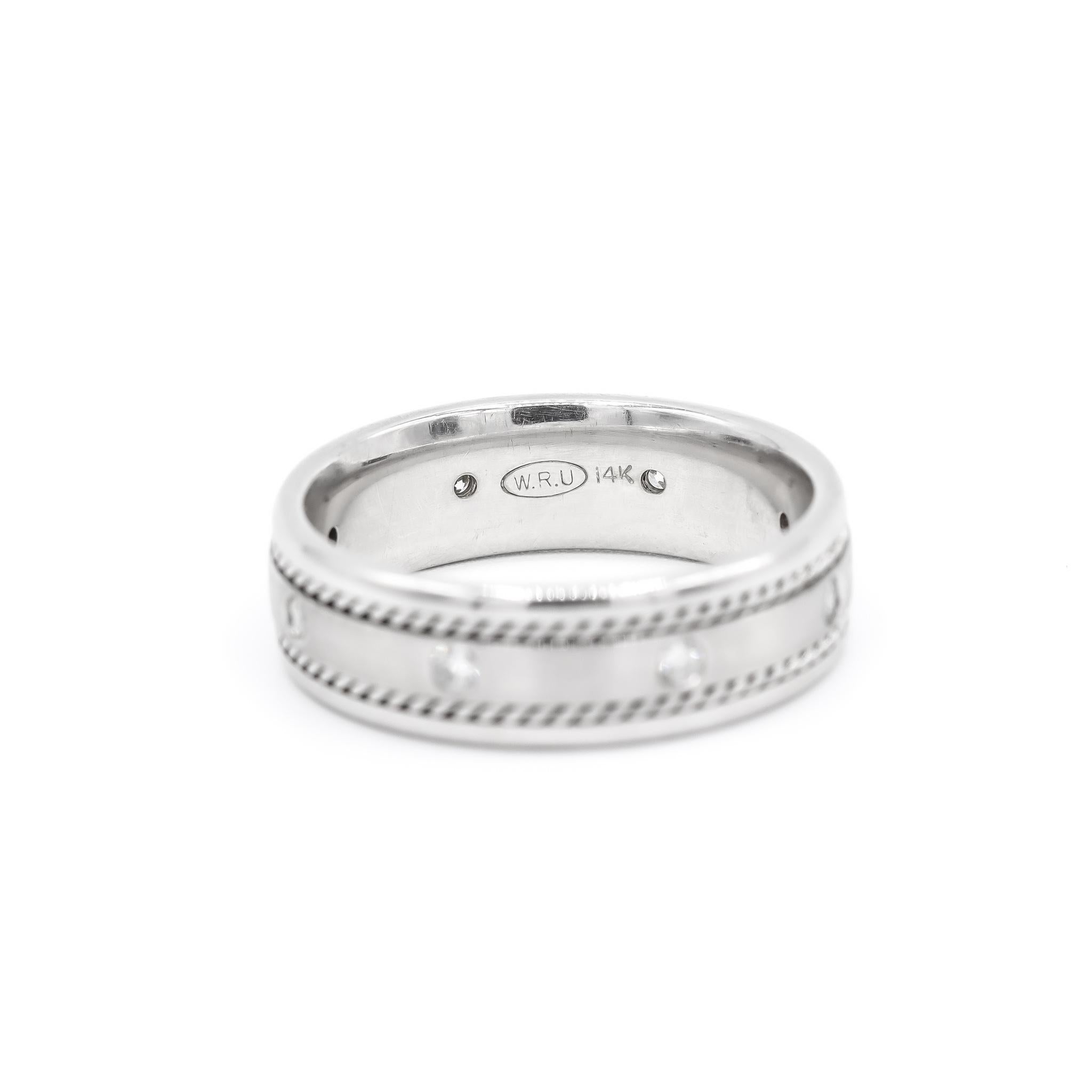 One man's custom made brushed & polished rhodium plated 14K white gold nine-across, diamond anniversary, wedding band with a soft-square shank. The band is a size 10. The band weighs a total of 9.00 grams. Engraved with 